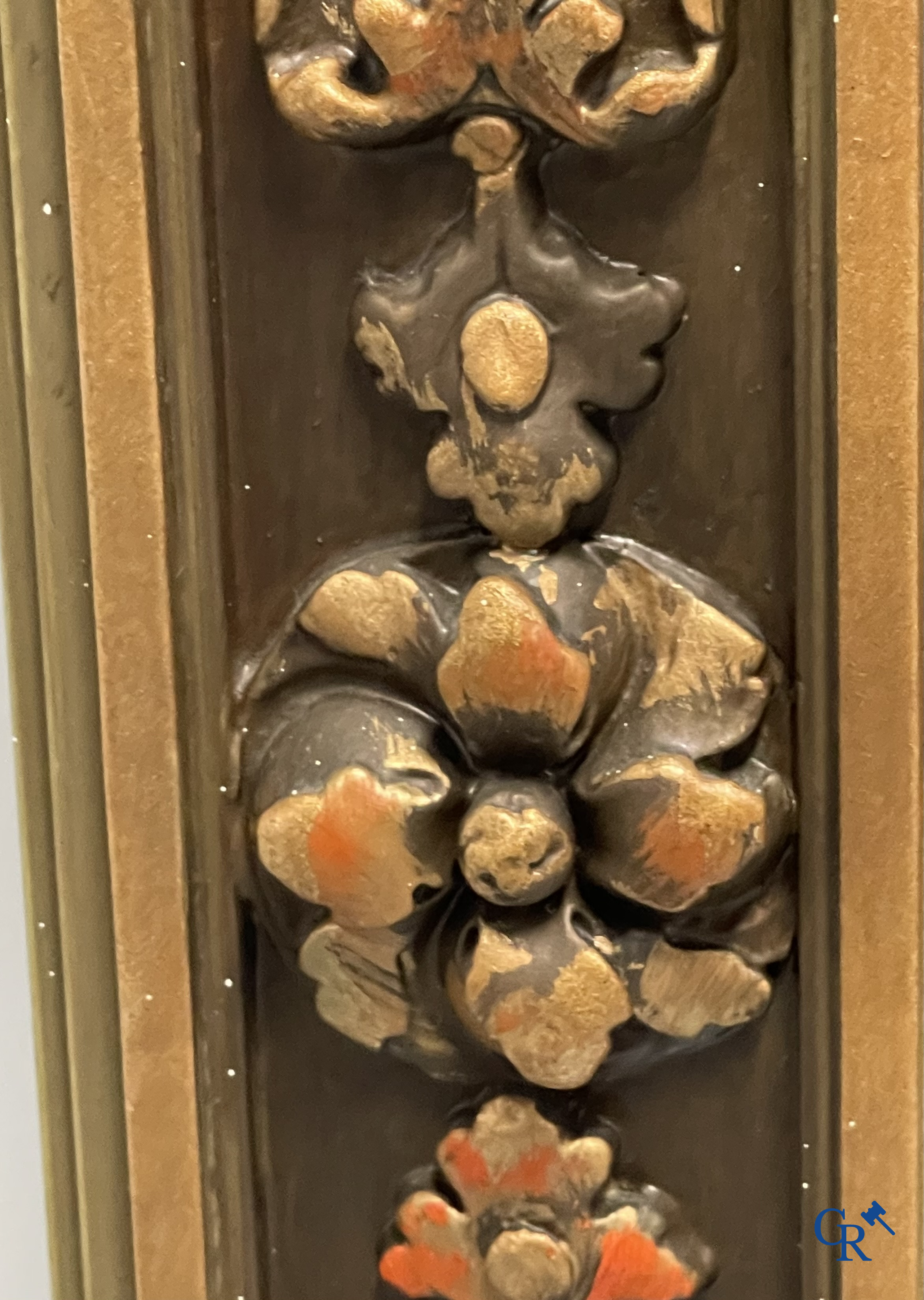 A large patinated fireplace mirror with a dragon. Around 1900.