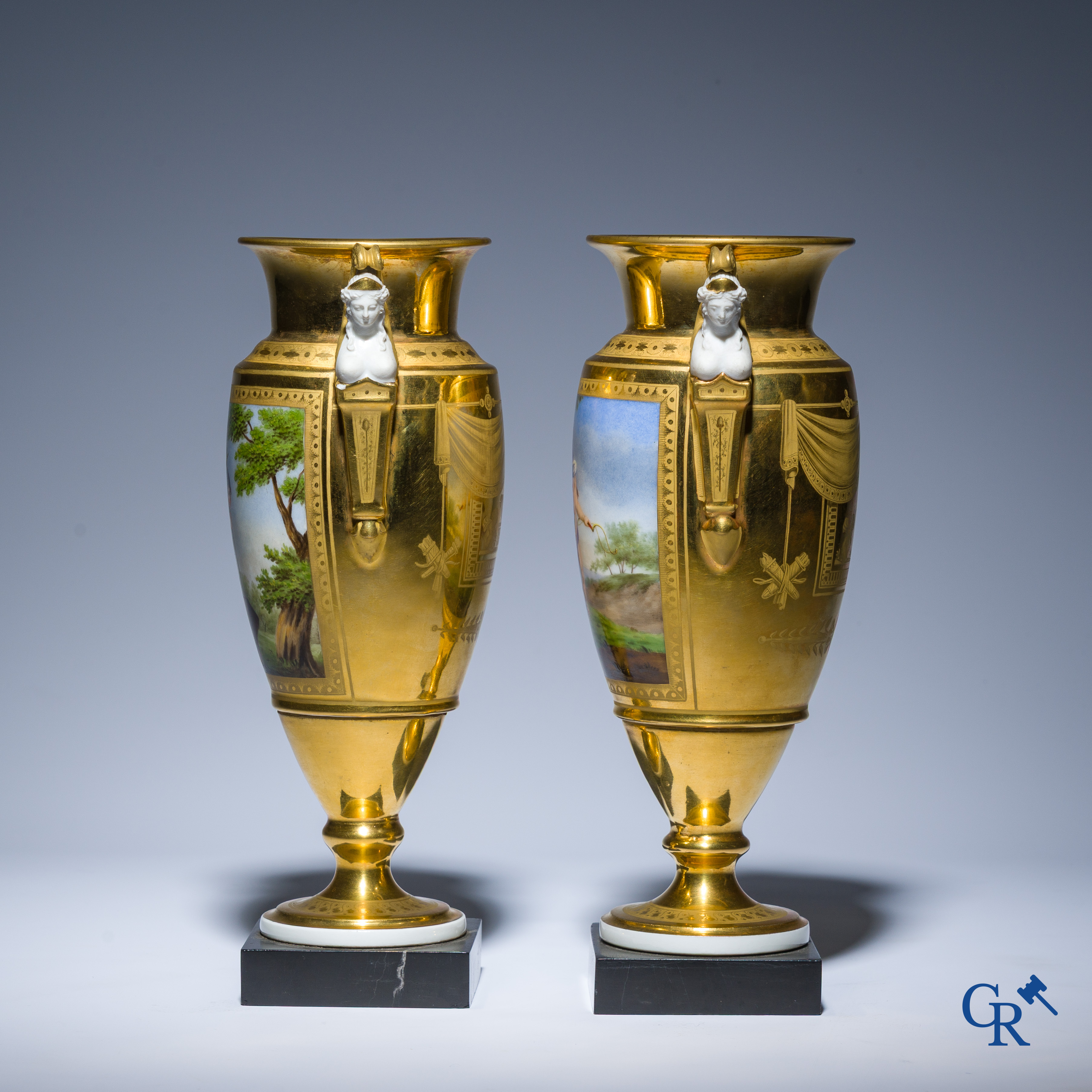 Empire, a pair of finely gilded and decorated vases in porcelain and biscuit on a marble pedestal, Circa 1810.