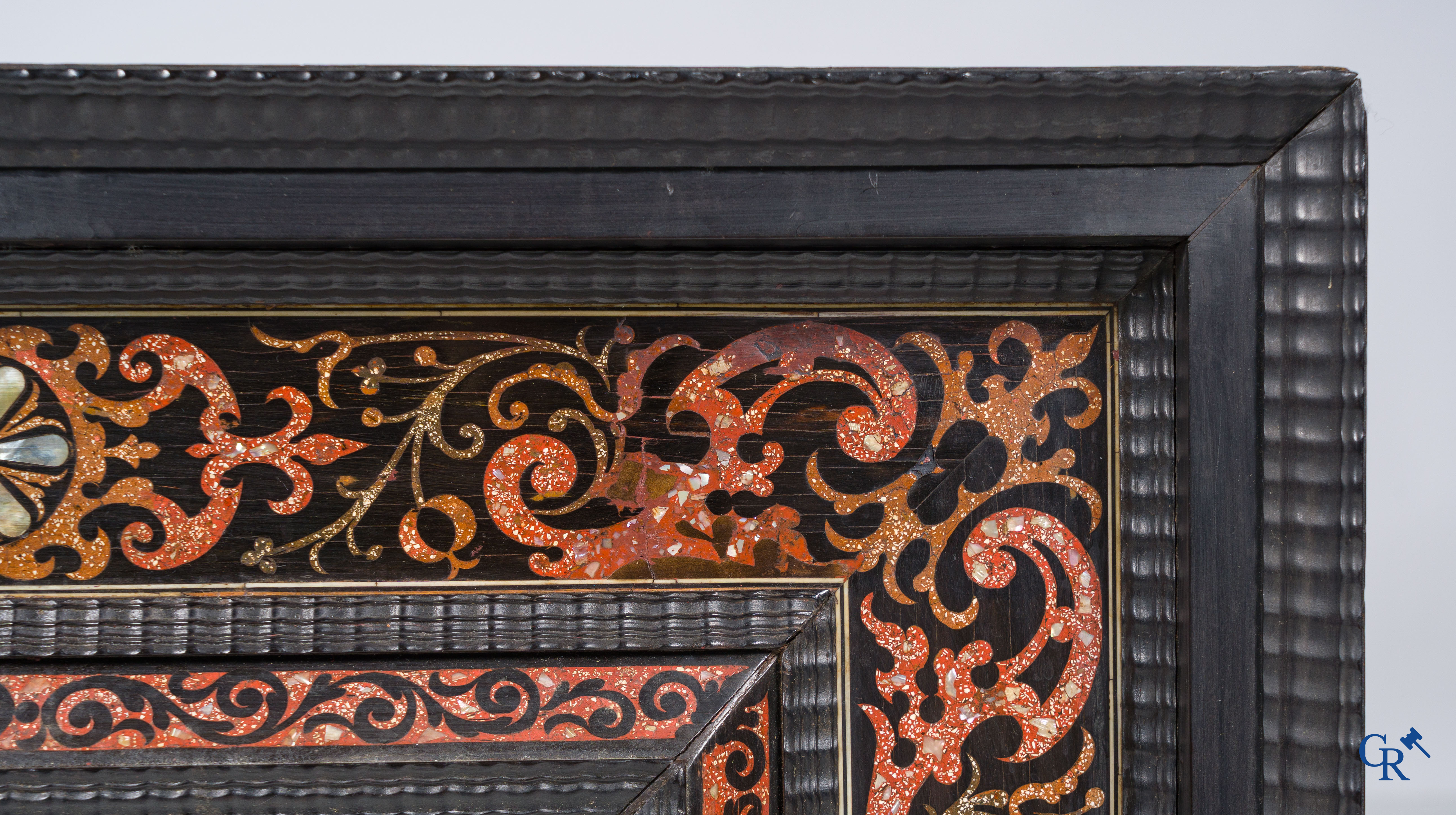 A mirror in ebony and inlay. 18th- 19th century.