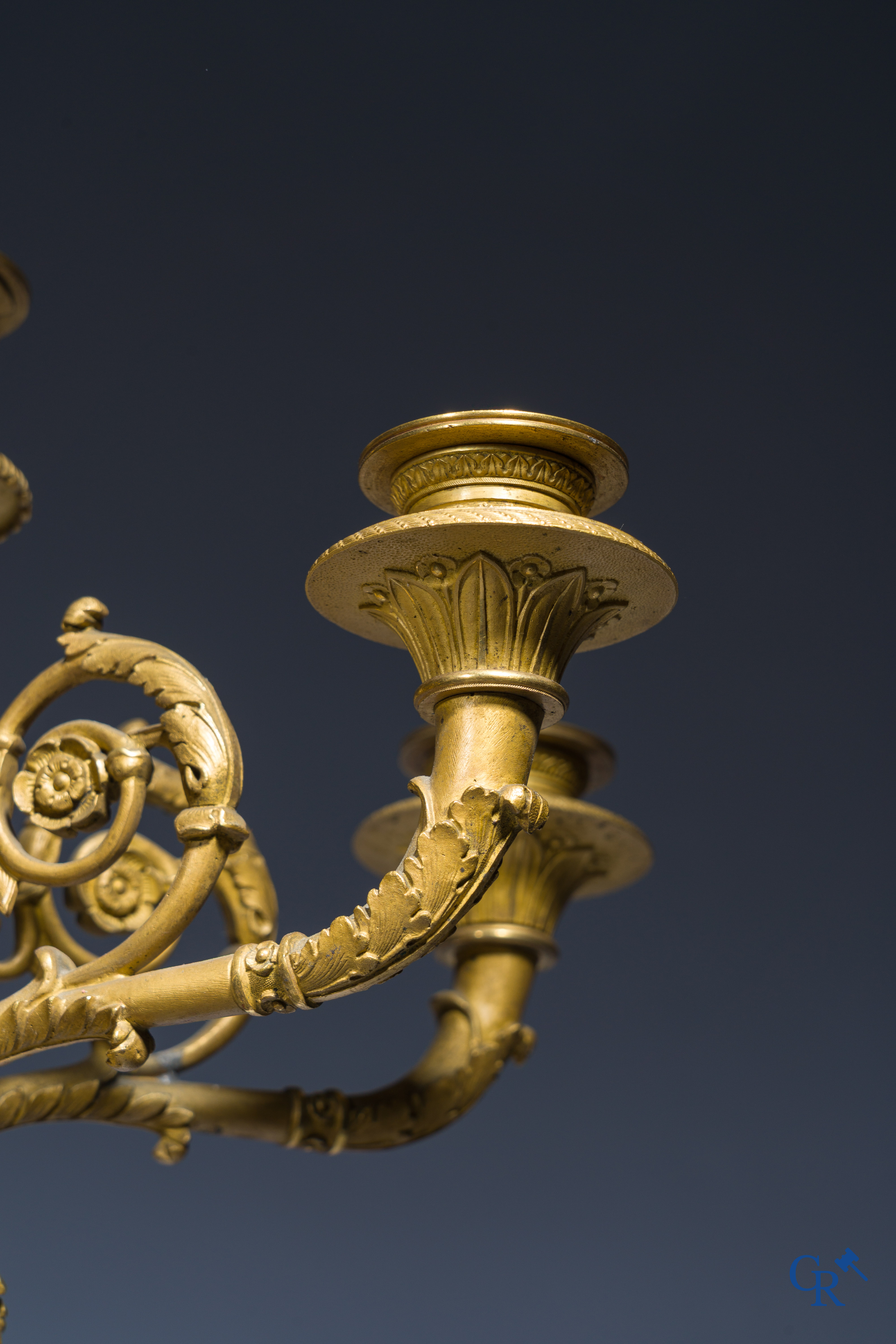 Empire, A pair of large gilded and patinated bronze candlesticks with winged women, circa 1810.