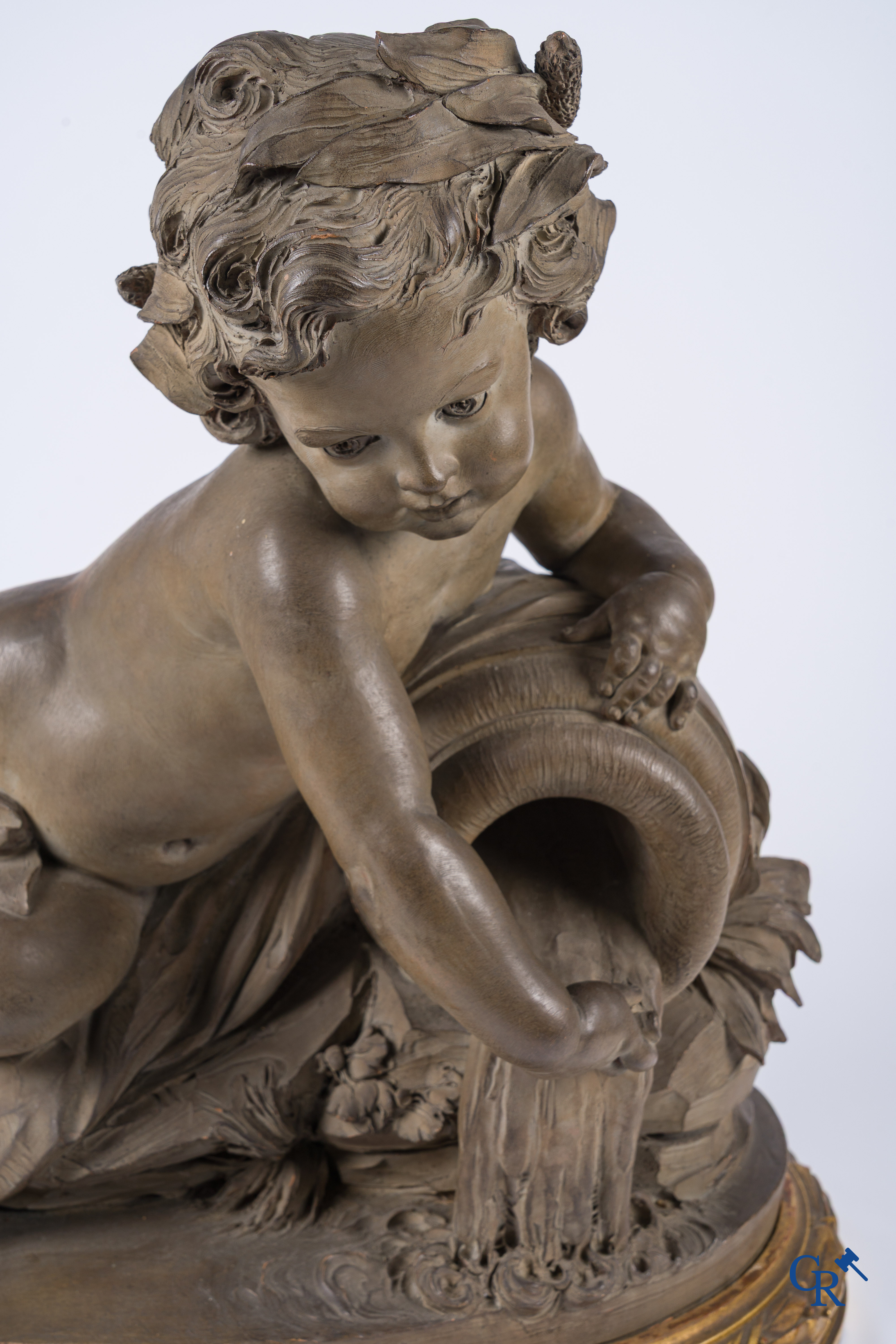 "La Source" A large terra cotta group on a wooden gilded pedestal. LXVI style. 19th century.