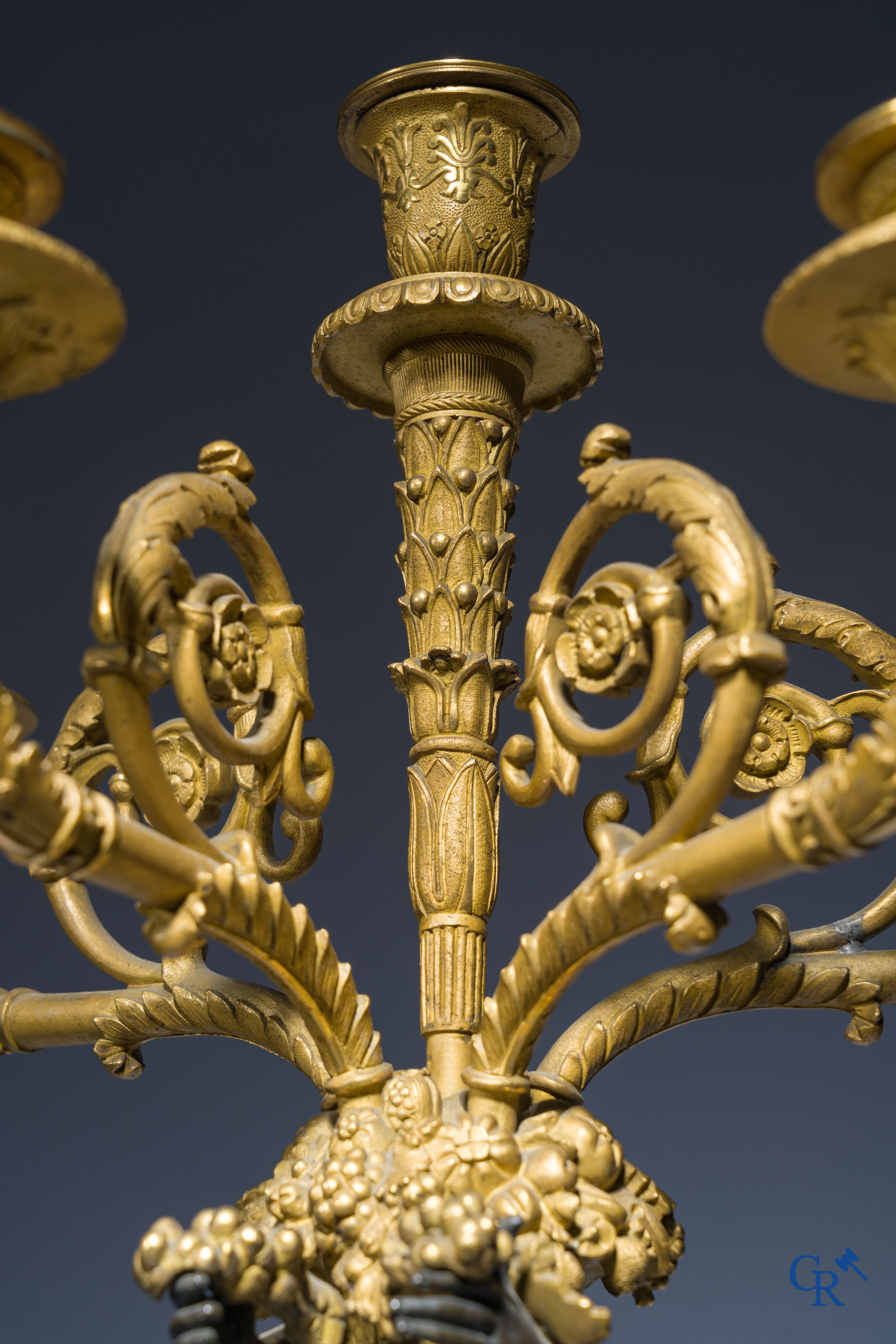 Empire, A pair of large gilded and patinated bronze candlesticks with winged women, circa 1810.