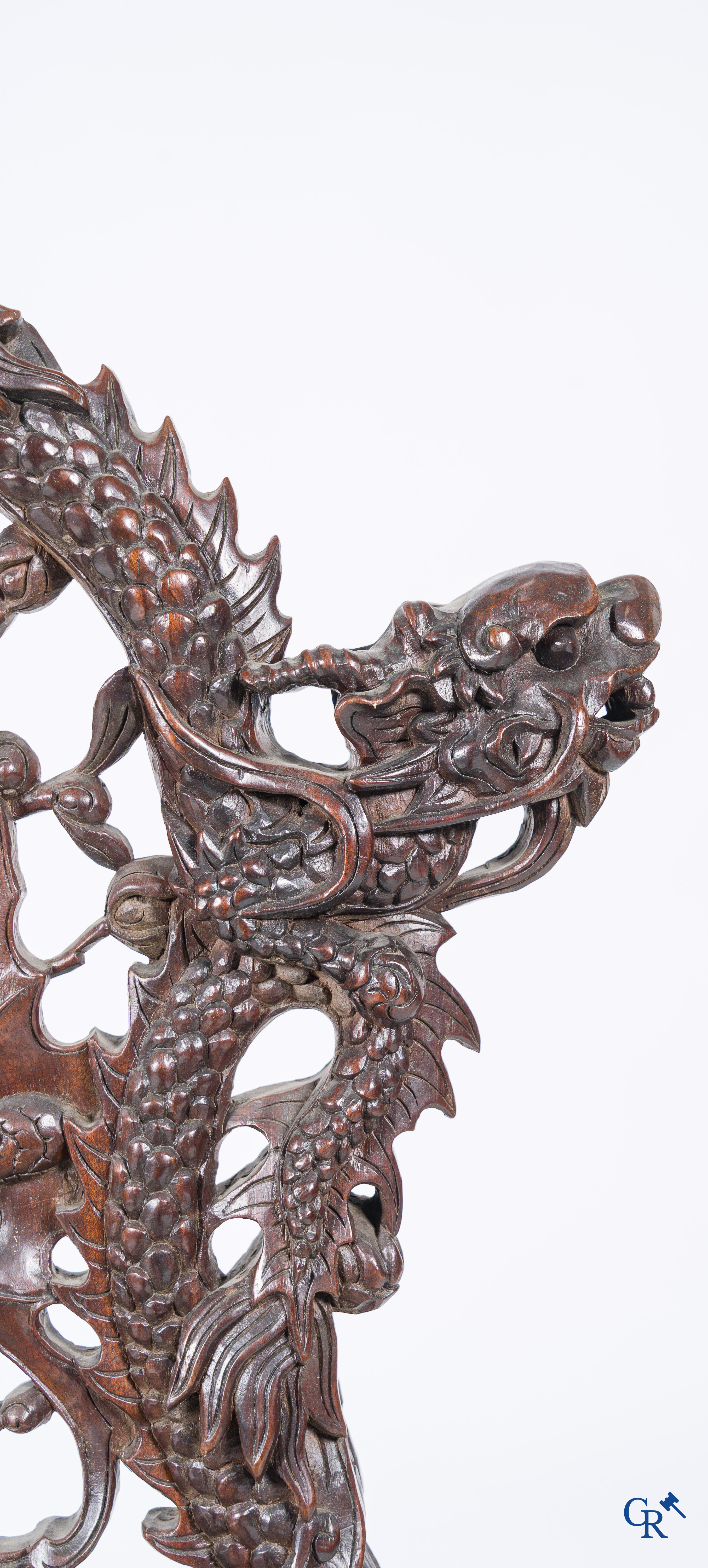 Asian Art, A pair of richly carved chairs with bats, dragons and flowers in Chinese hardwood. 19th century.