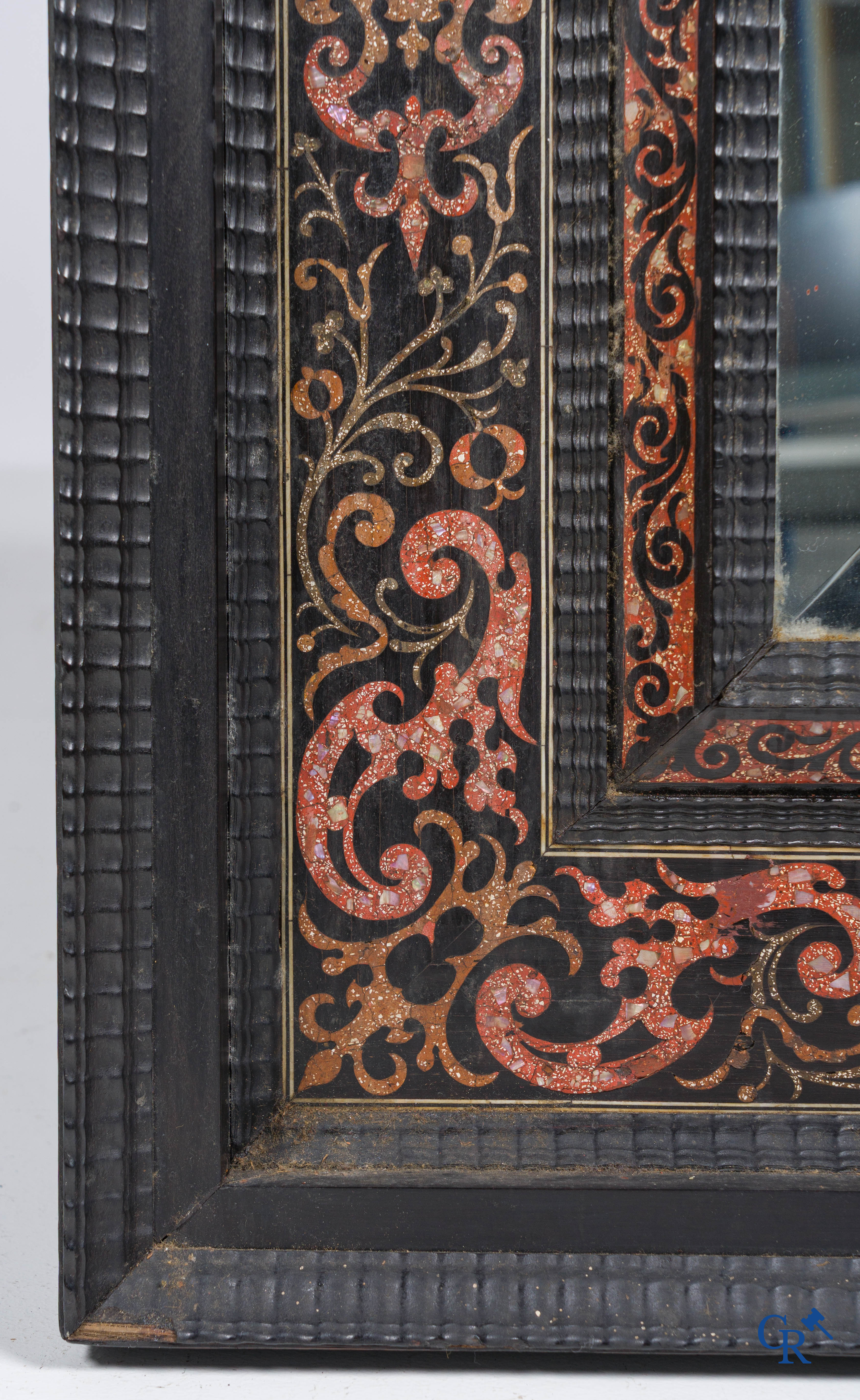 A mirror in ebony and inlay. 18th- 19th century.