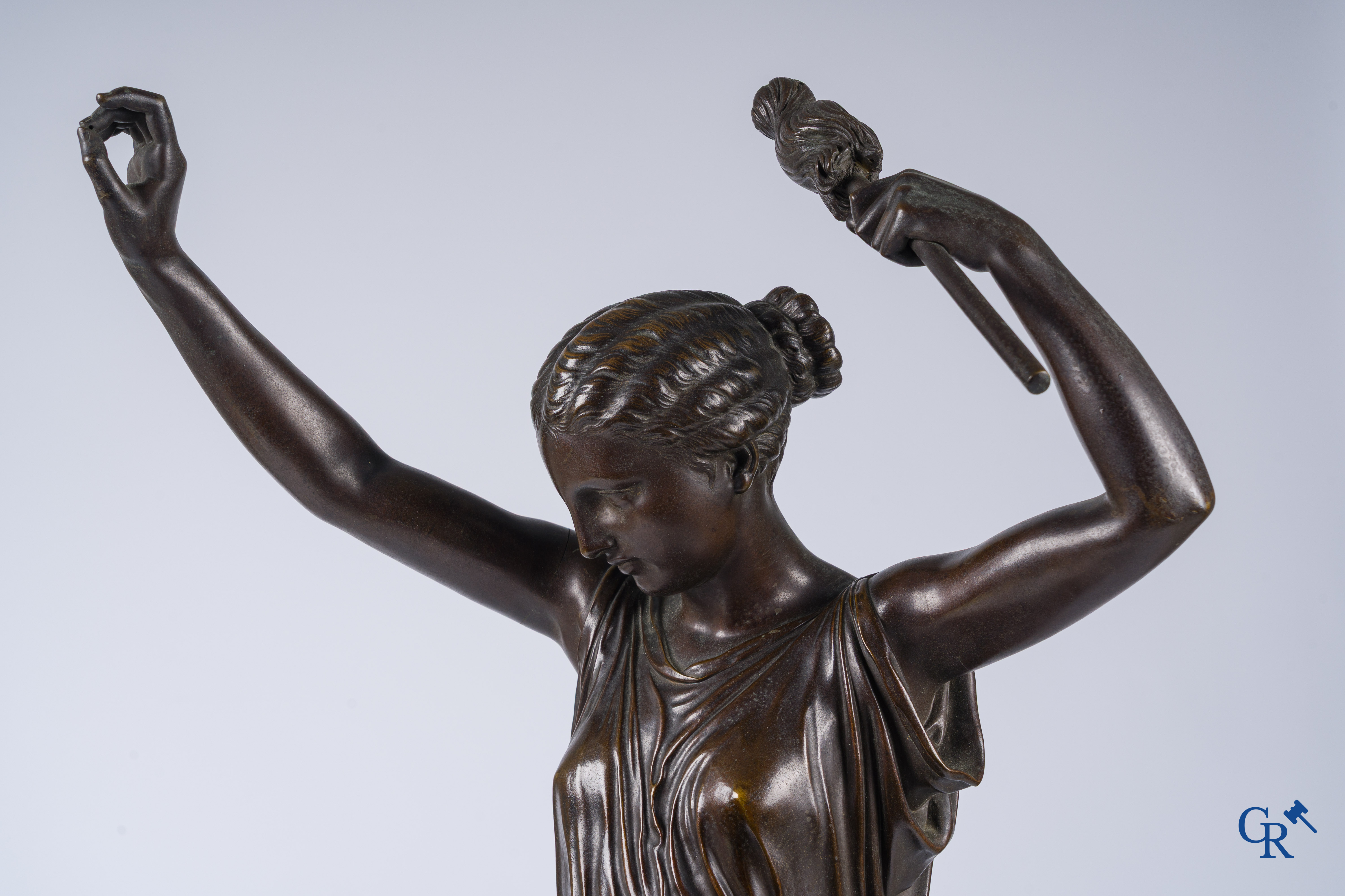 Louis Léon Cugnot (1835-1894) A large 3-piece bronze chimney set "La Fileuse" Signed L. Cugnot.