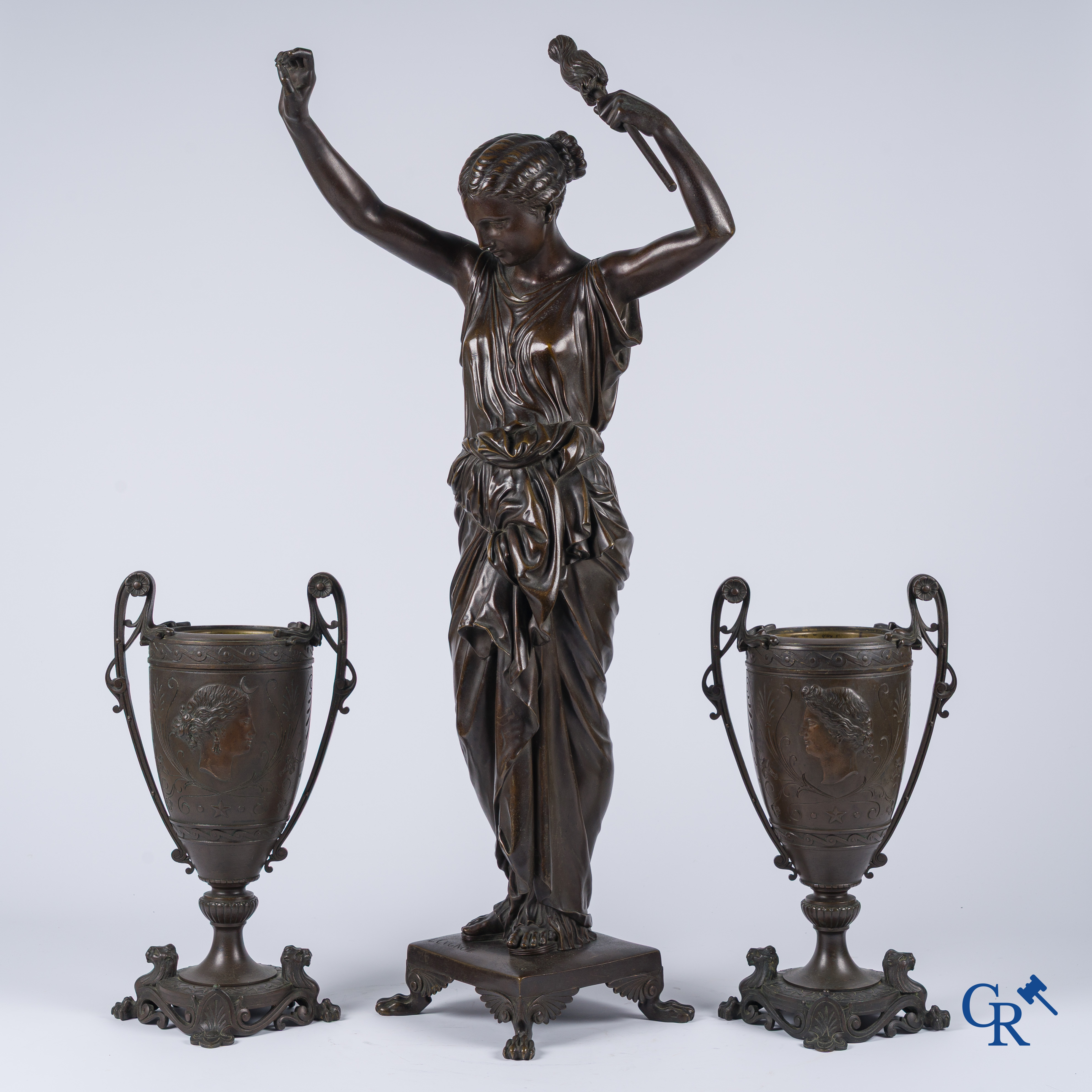 Louis Léon Cugnot (1835-1894) A large 3-piece bronze chimney set "La Fileuse" Signed L. Cugnot.