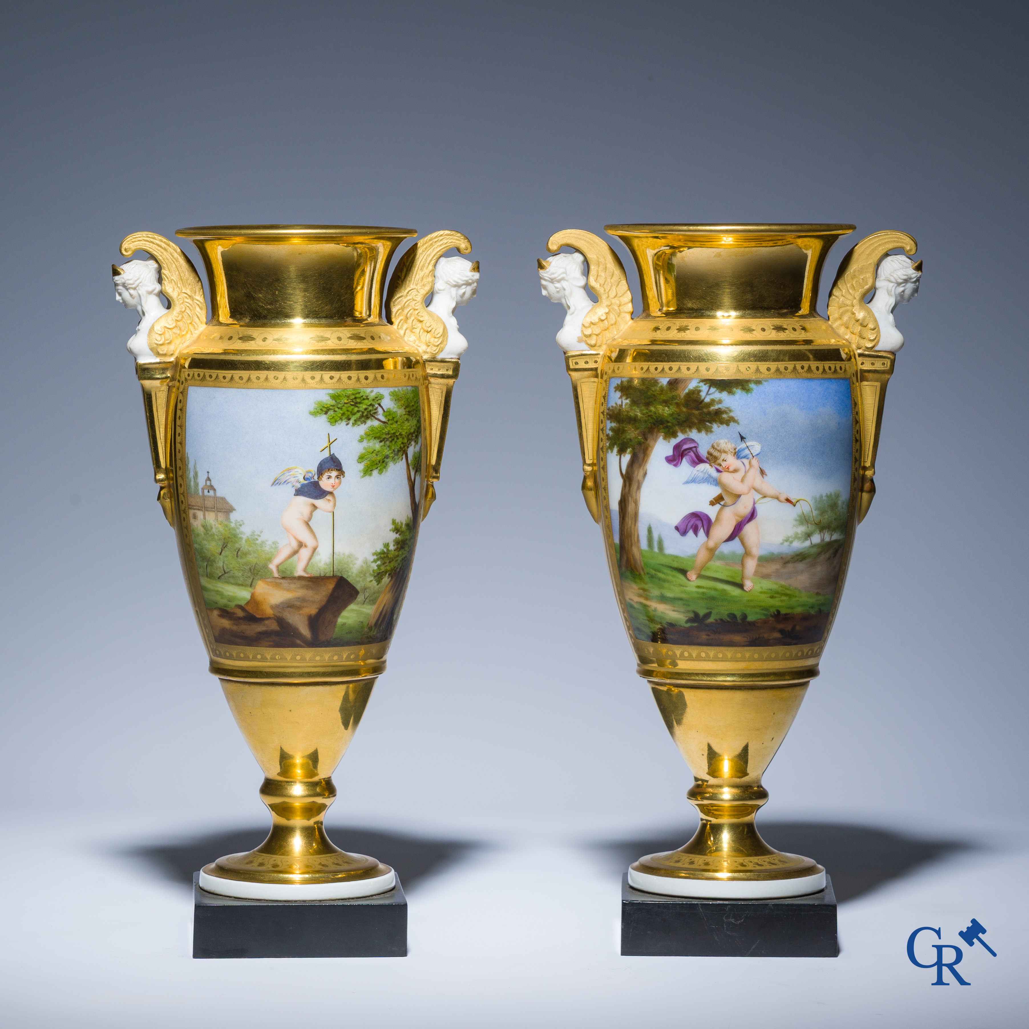 Empire, a pair of finely gilded and decorated vases in porcelain and biscuit on a marble pedestal, Circa 1810.