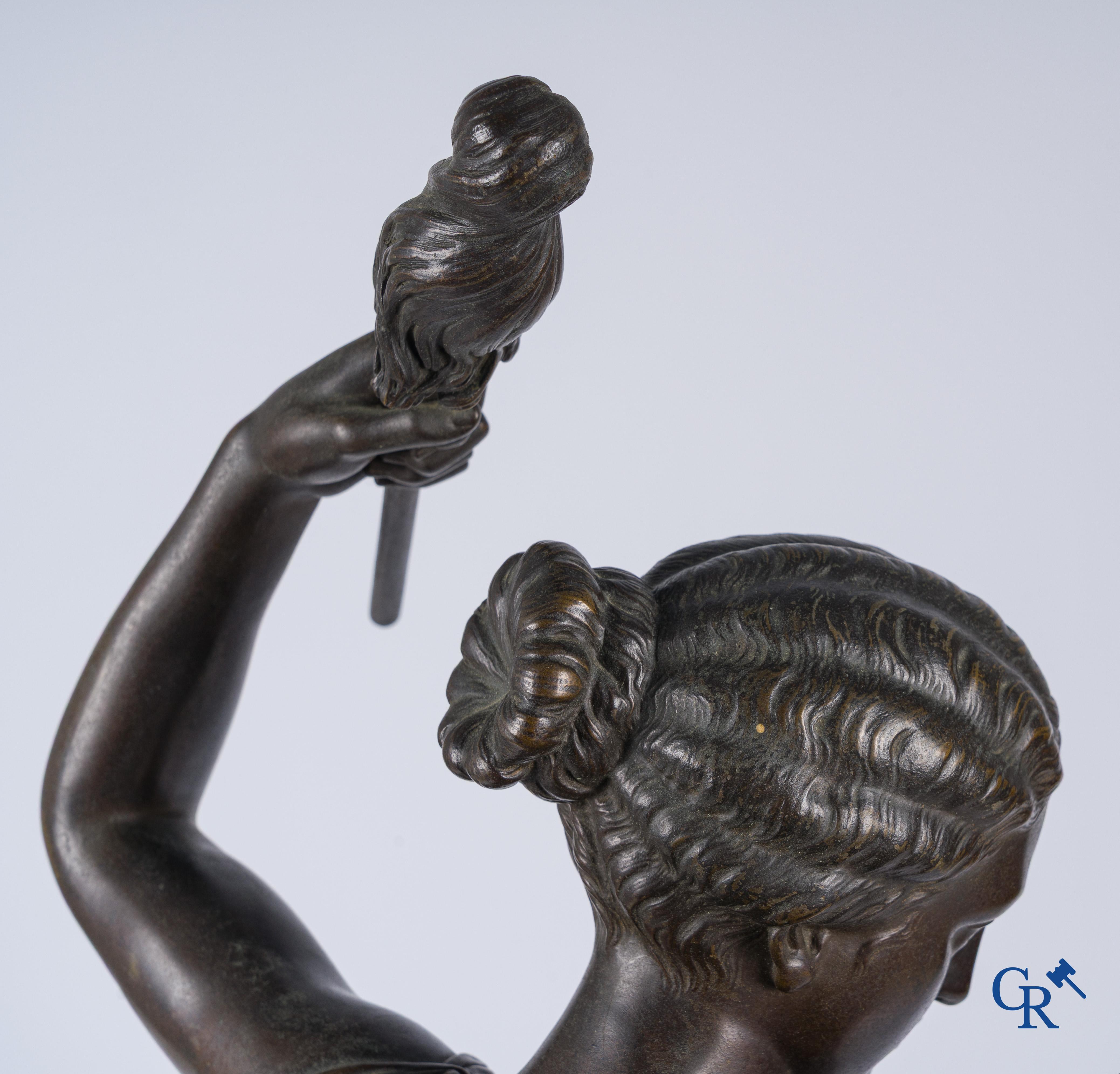 Louis Léon Cugnot (1835-1894) A large 3-piece bronze chimney set "La Fileuse" Signed L. Cugnot.