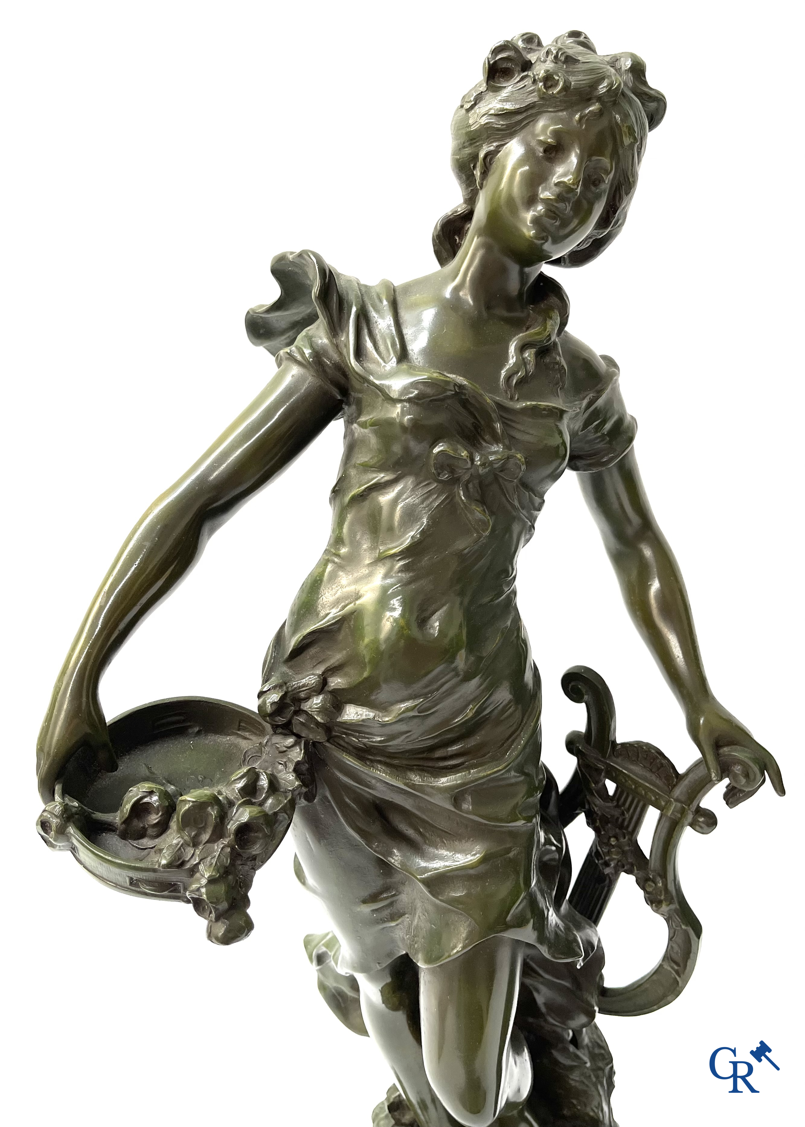 Louis & François Moreau, A large pair of statues in green patinated spelter on a wooden base. Signed L&F Moreau.