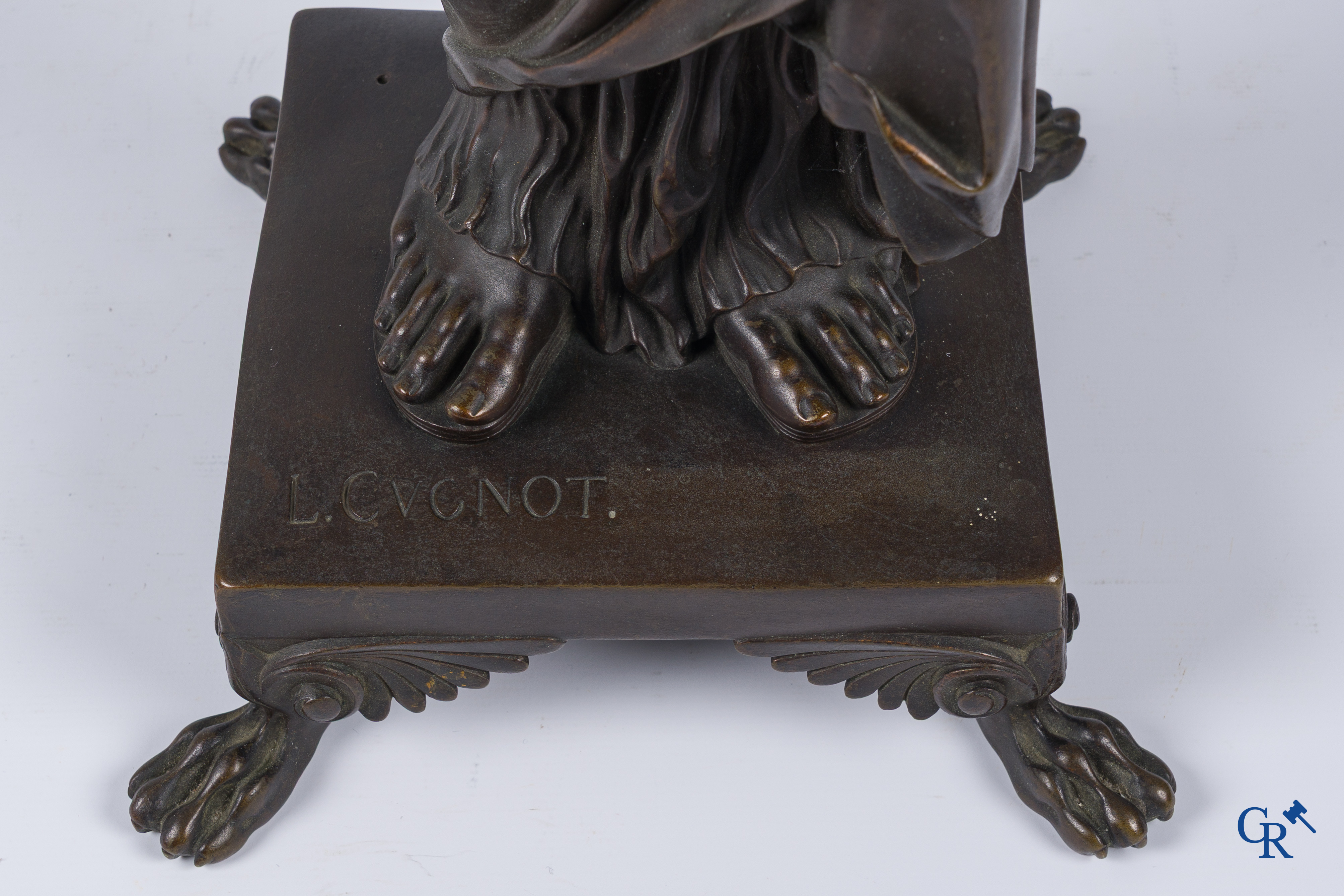 Louis Léon Cugnot (1835-1894) A large 3-piece bronze chimney set "La Fileuse" Signed L. Cugnot.