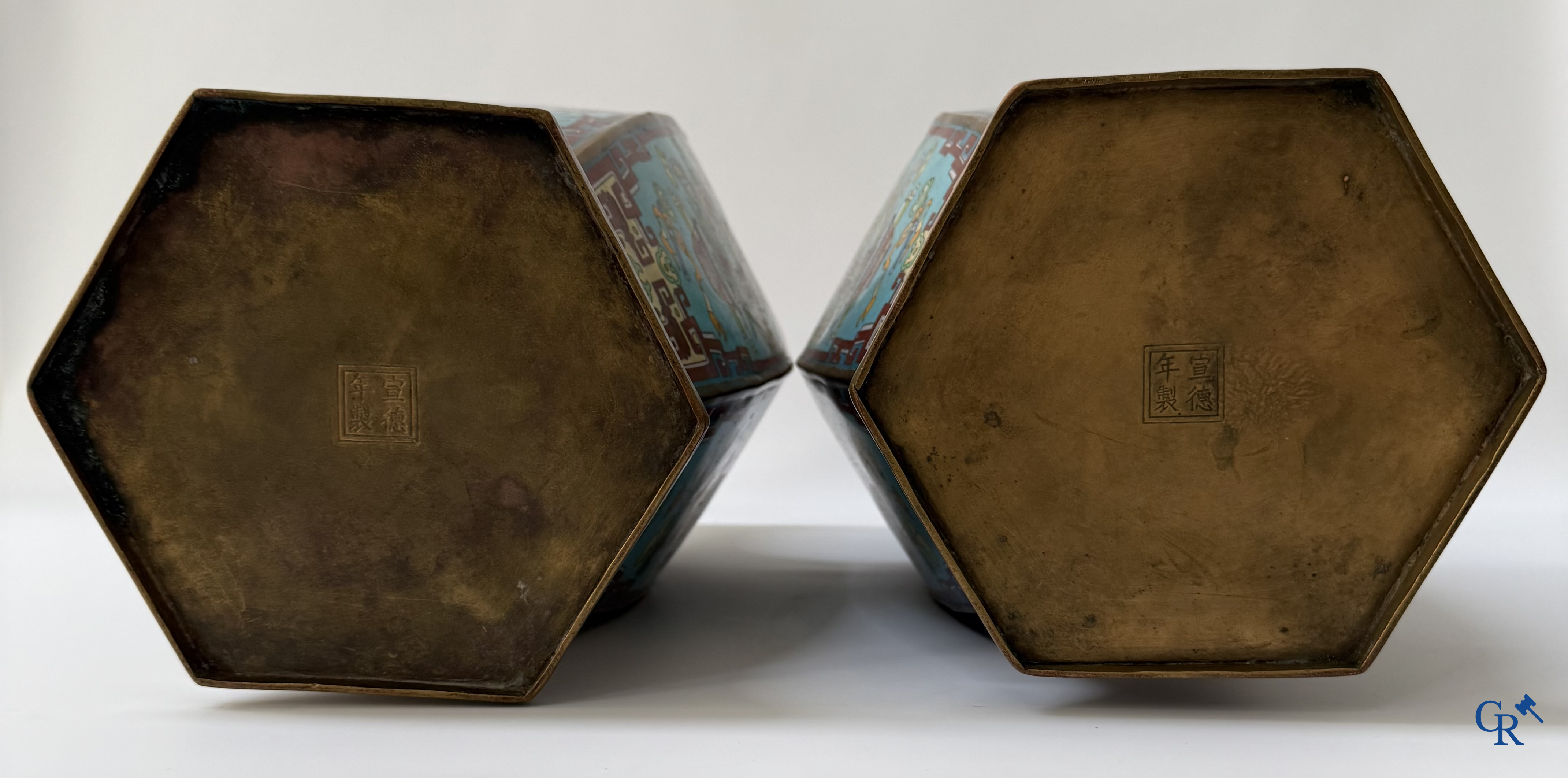 Asian Art, a large pair of hexagonal Chinese cloisonné vases with a decor of antiques.