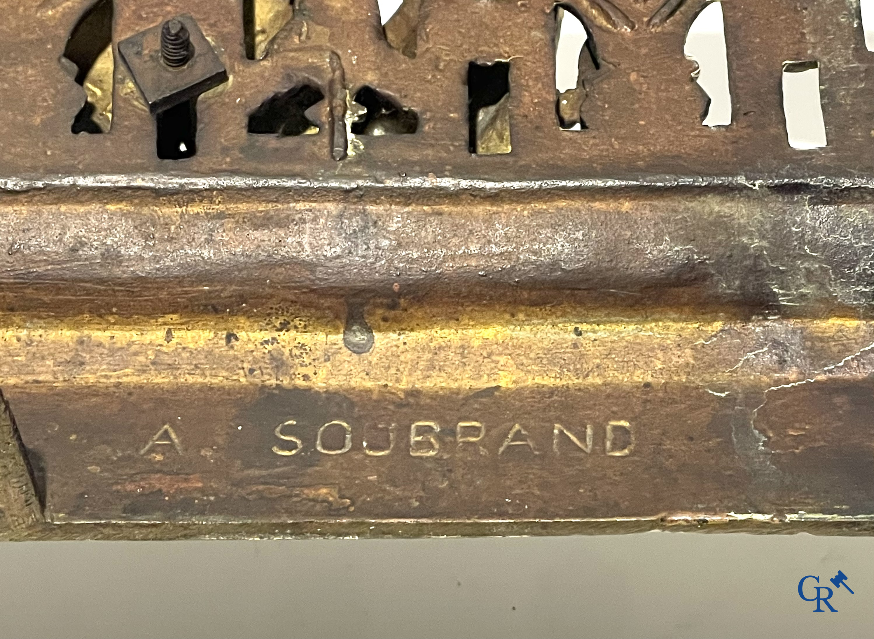 A lot of an imposing chandelier with 12 light points, a lamp belge with bronze frame and a fireplace piece.