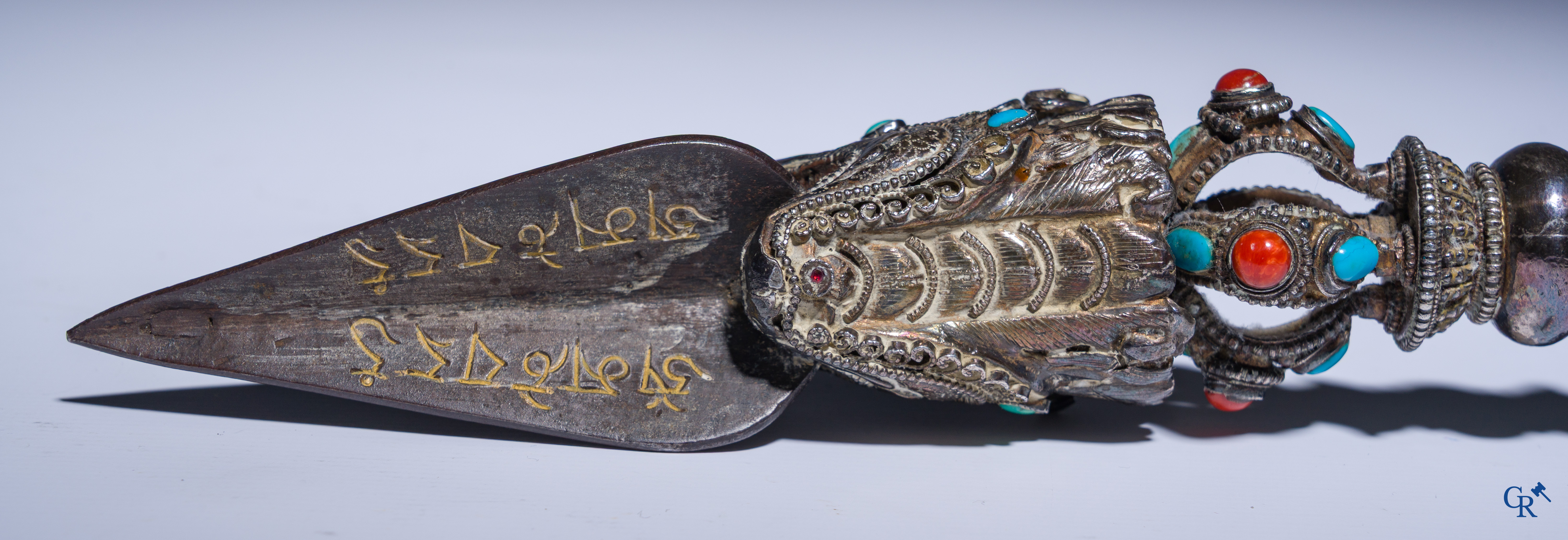 Asian Art, Phurba. Tibetan ritual dagger in silver, inlaid with turquoise and red coral.