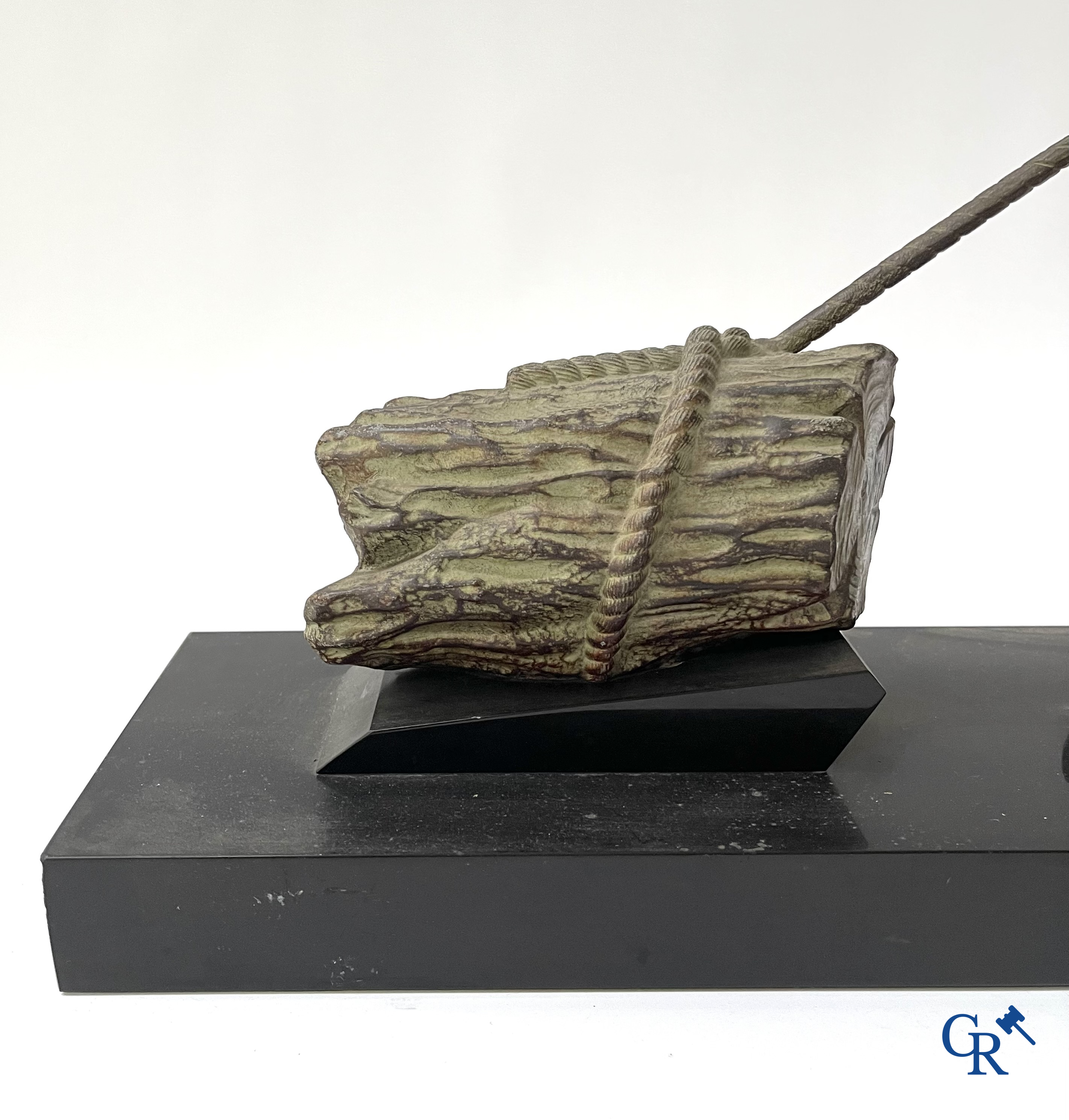 Art deco, a statue in green-brown patinated spelter on a black marble base. Around 1930.