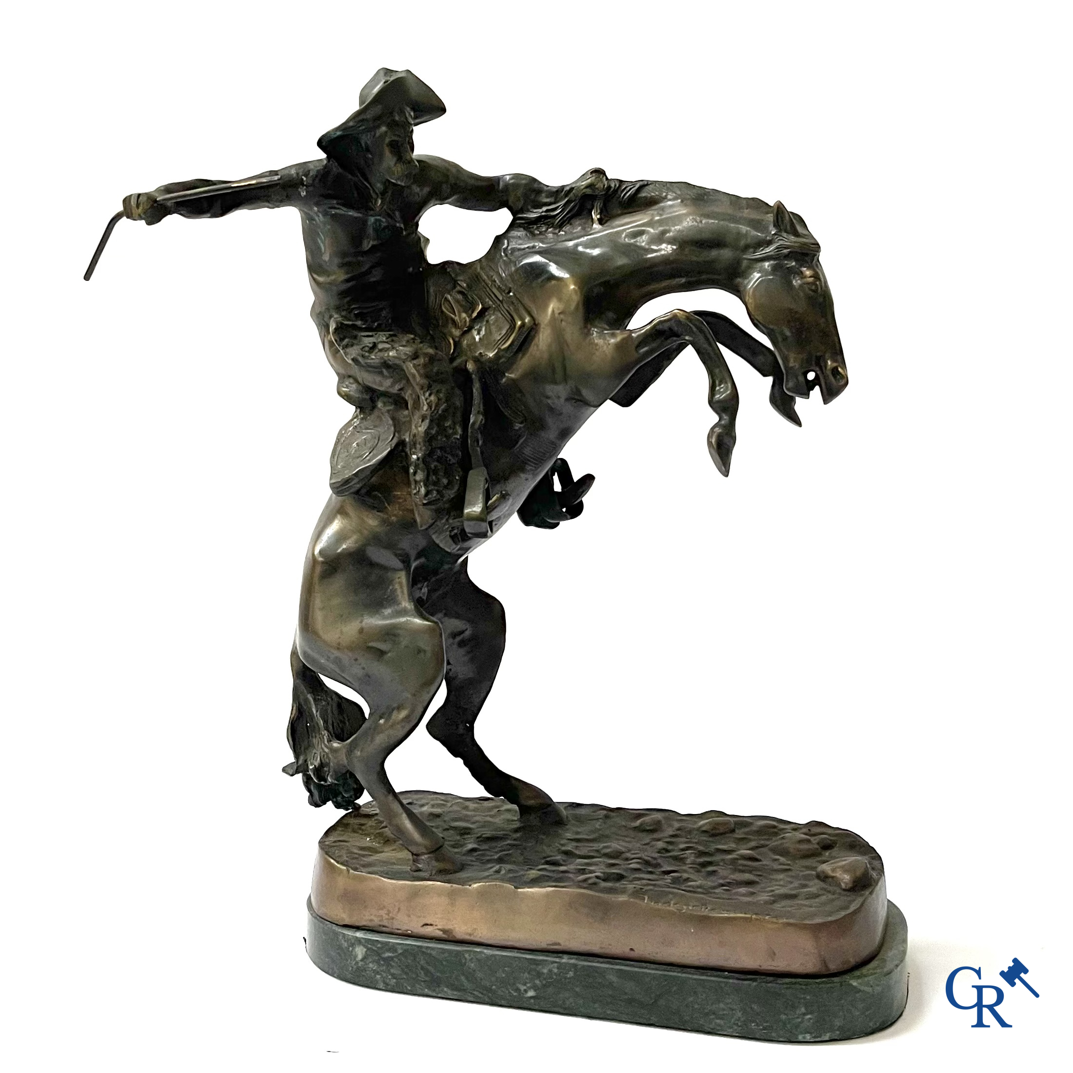 Frederic Remington (after) The bronco buster. Bronze on a green veined marble base. Posthumous. 20th century.