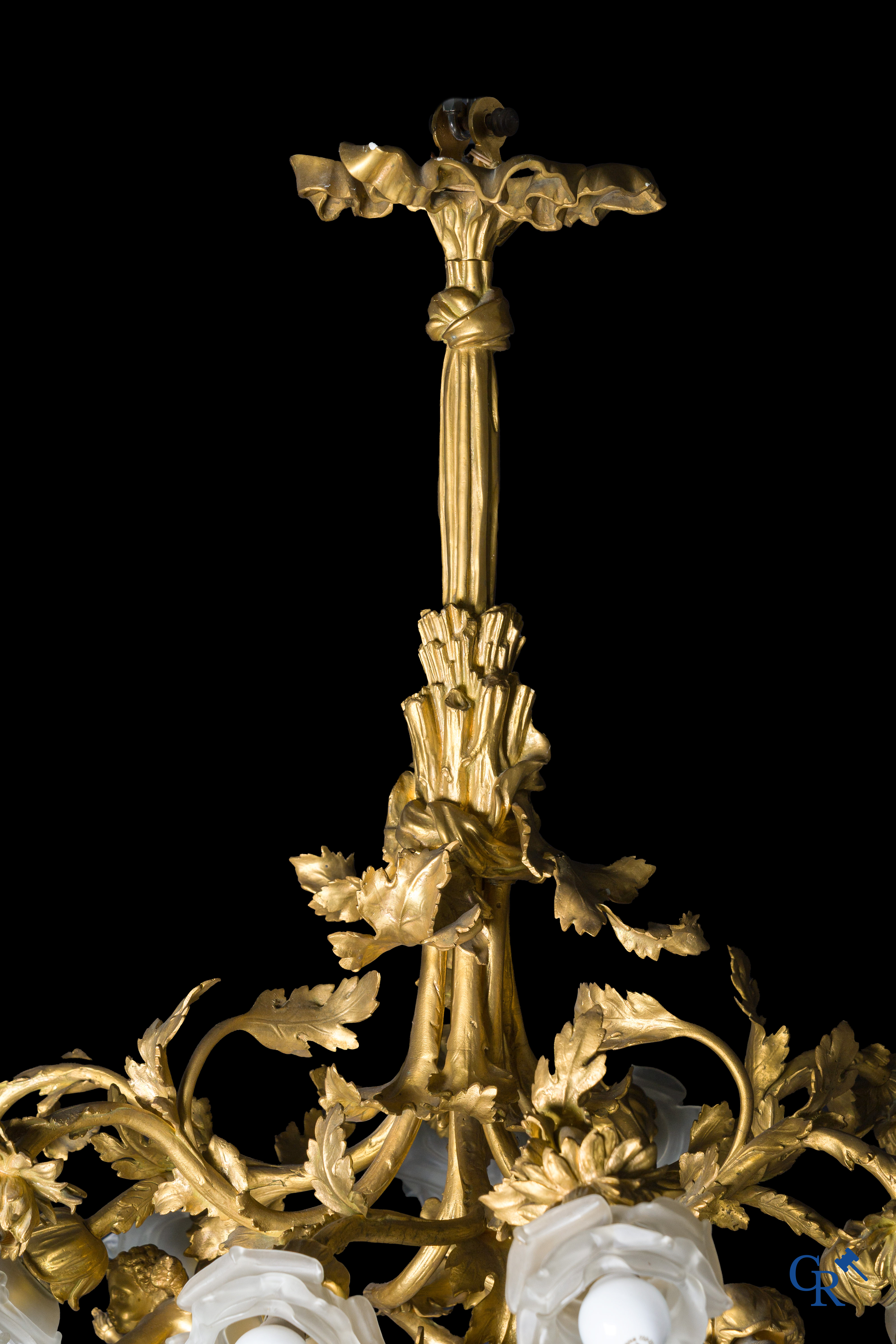 An imposing bronze gilded Napoleon III chandelier with 3 putti and 13 light points. LXVI style.