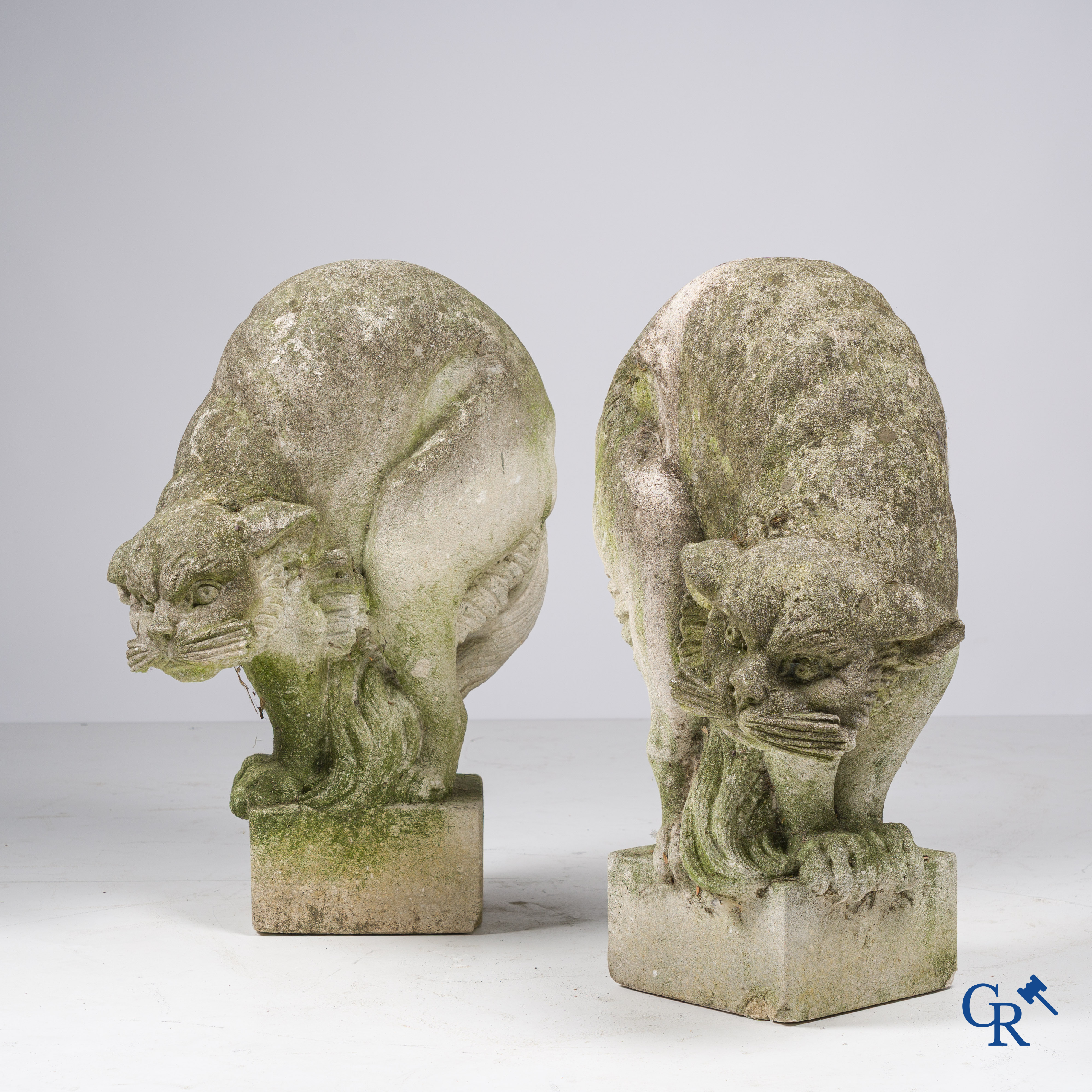 Exceptionally pair of large ornaments depicting cats in hand-sculpted limestone. Circa 1900.