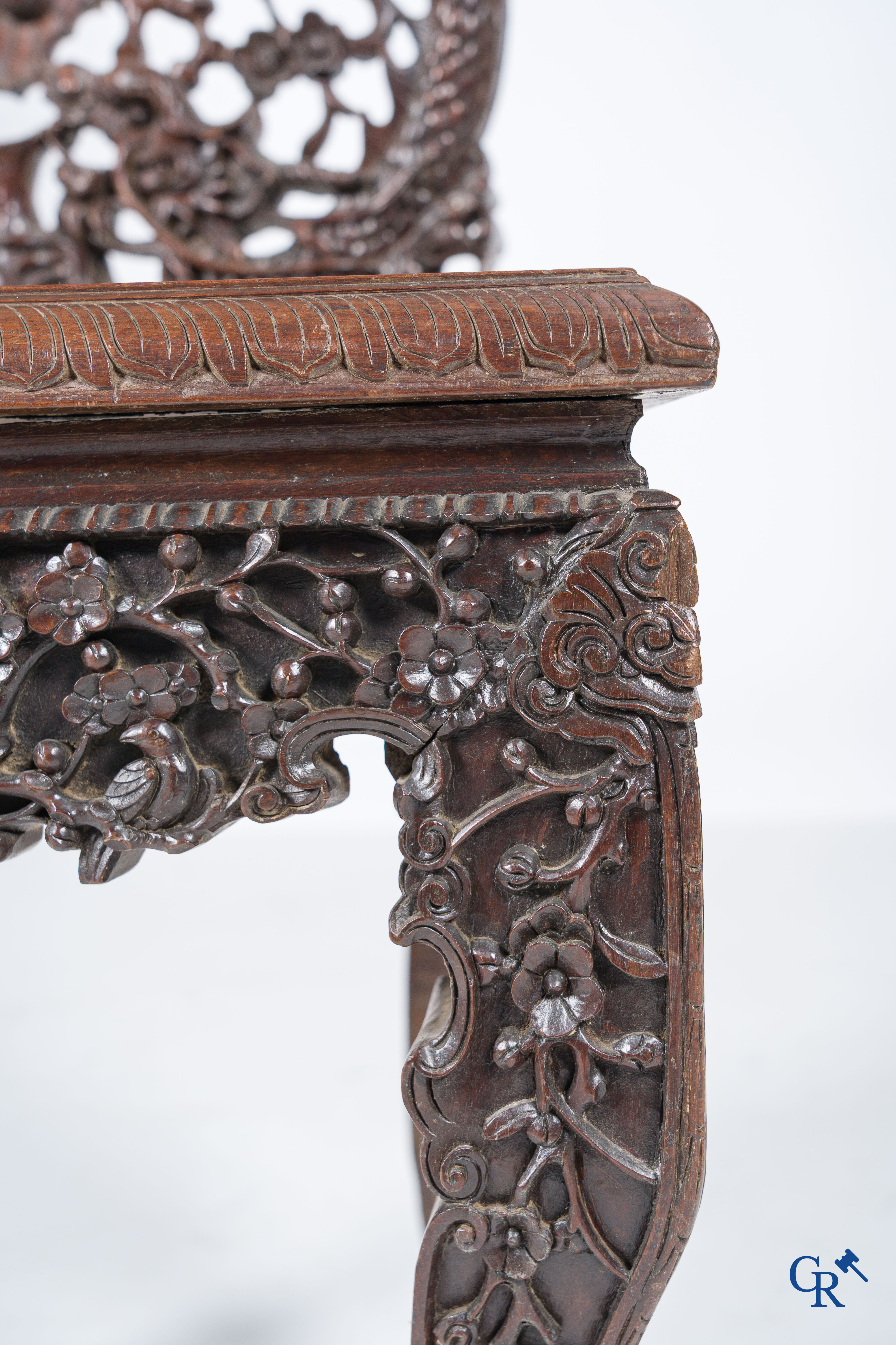 Asian Art, A pair of richly carved chairs with bats, dragons and flowers in Chinese hardwood. 19th century.