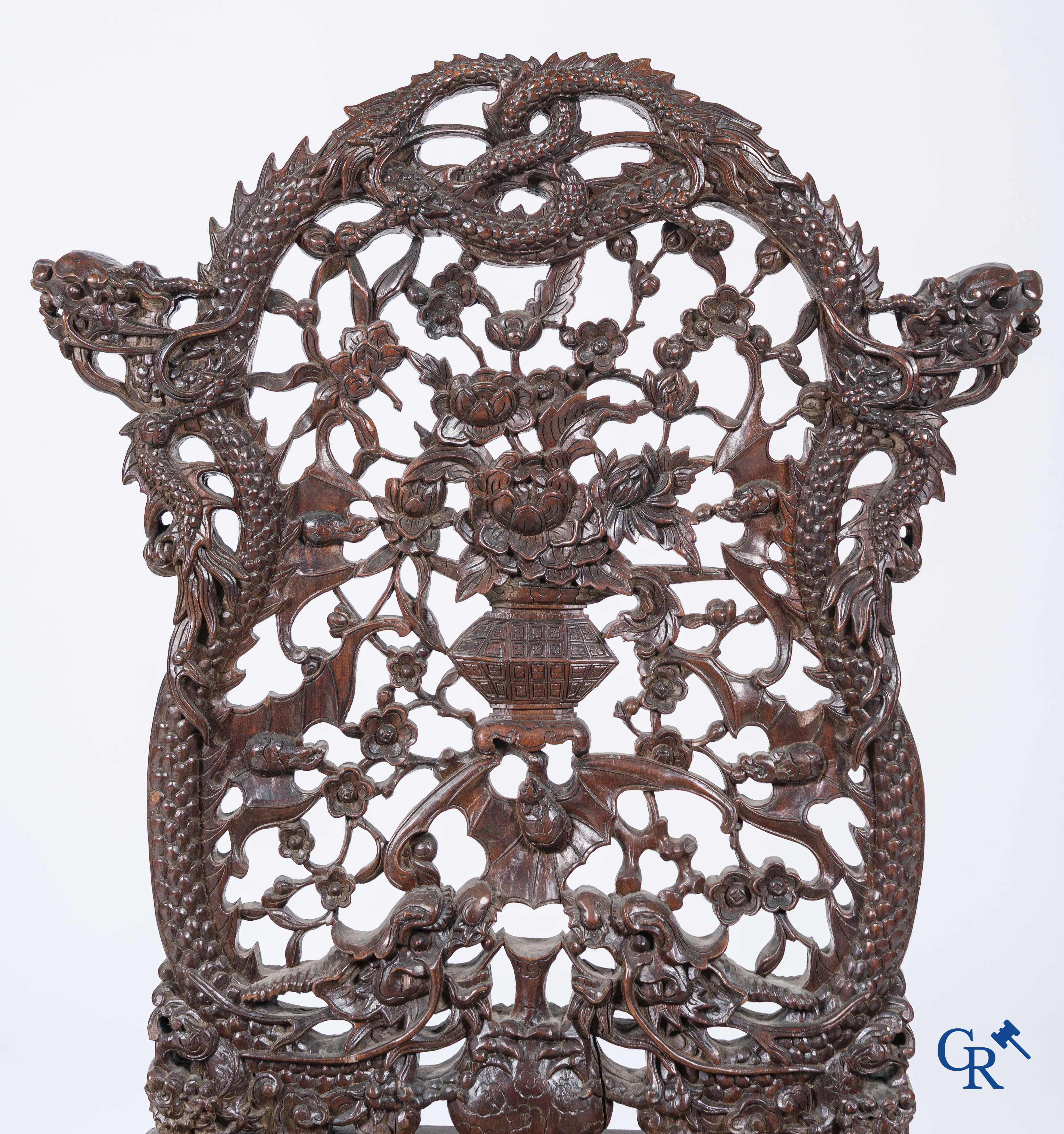 Asian Art, A pair of richly carved chairs with bats, dragons and flowers in Chinese hardwood. 19th century.