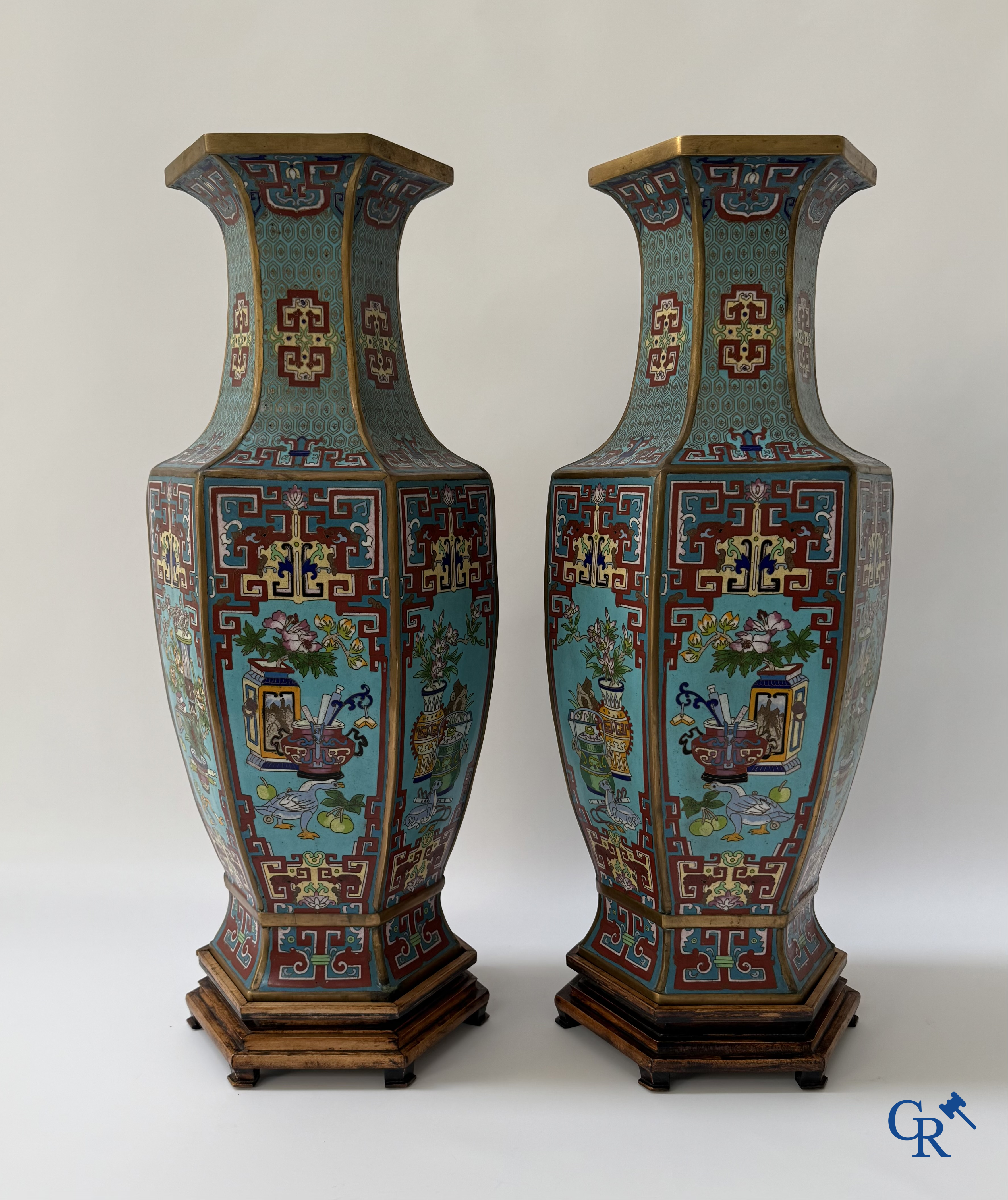 Asian Art, a large pair of hexagonal Chinese cloisonné vases with a decor of antiques.