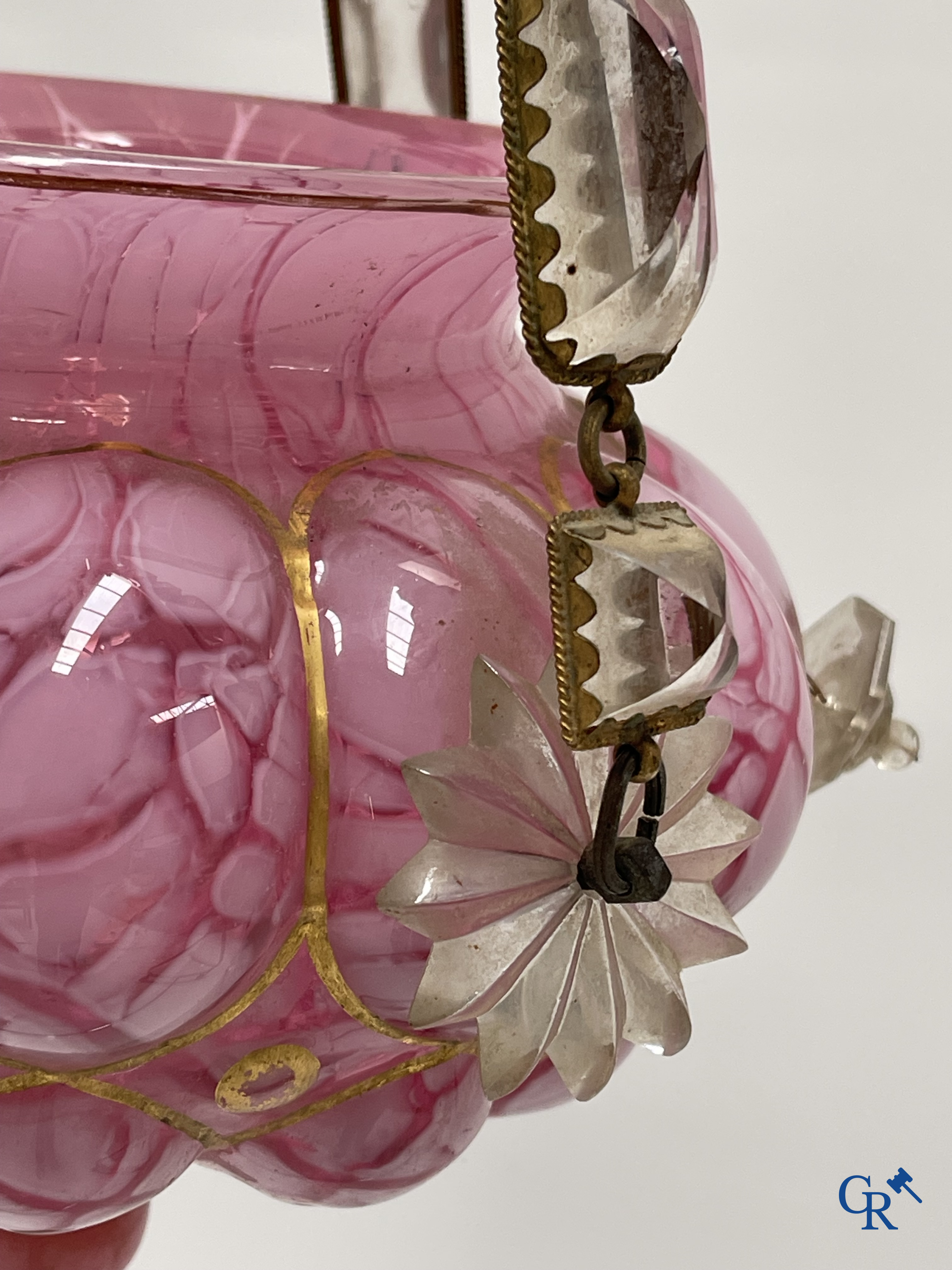 A chandelier in pink opaline and gilded frames with mounted crystal in the style of Baccarat. Circa 1860.