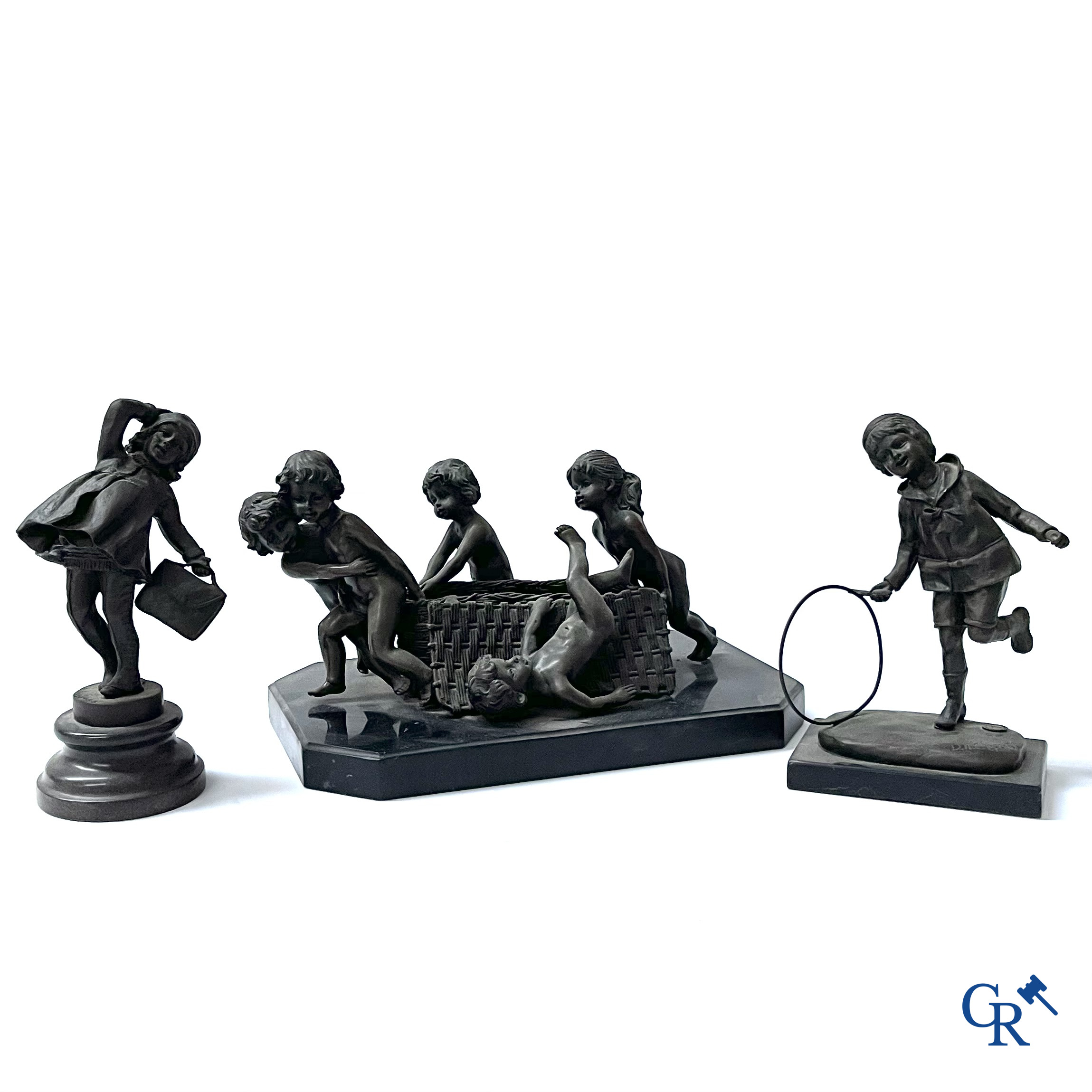 A bronze group after Raoul Larche with 5 children and a basket and 2 bronze statuettes after Chiparus. Posthumous 20th century.