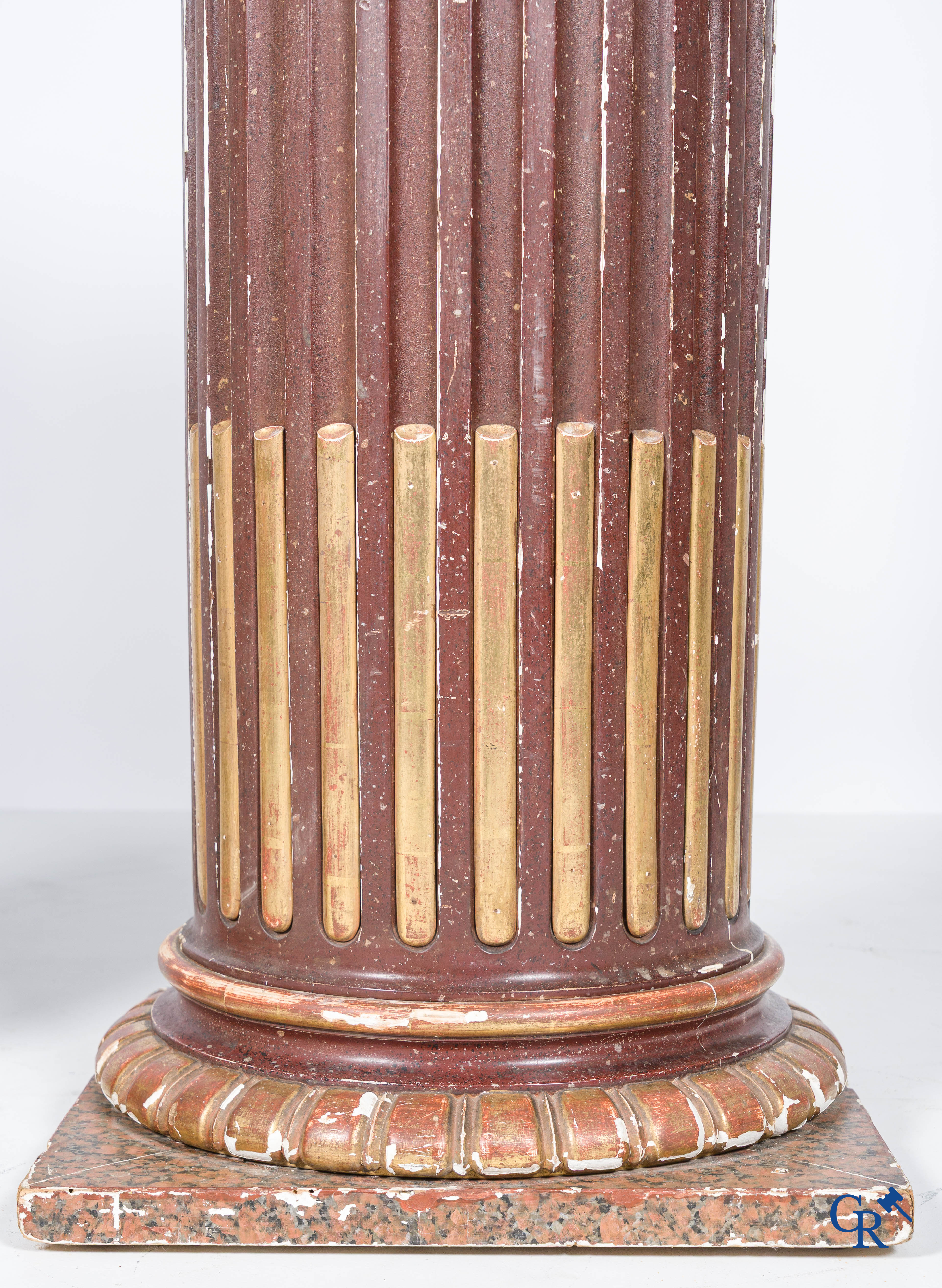 A pair of fluted, patinated and gilded wood sculpted columns. 19th century.