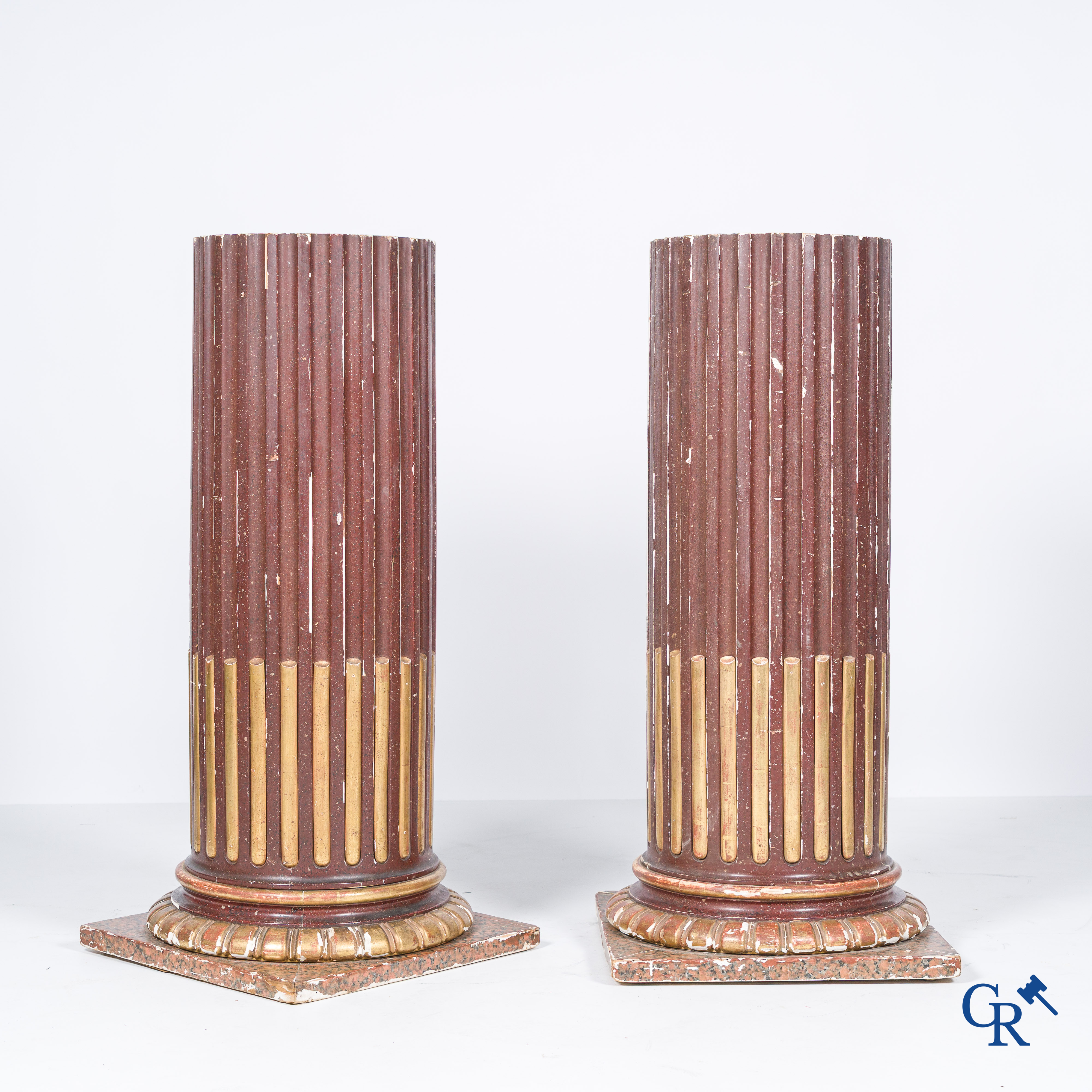 A pair of fluted, patinated and gilded wood sculpted columns. 19th century.