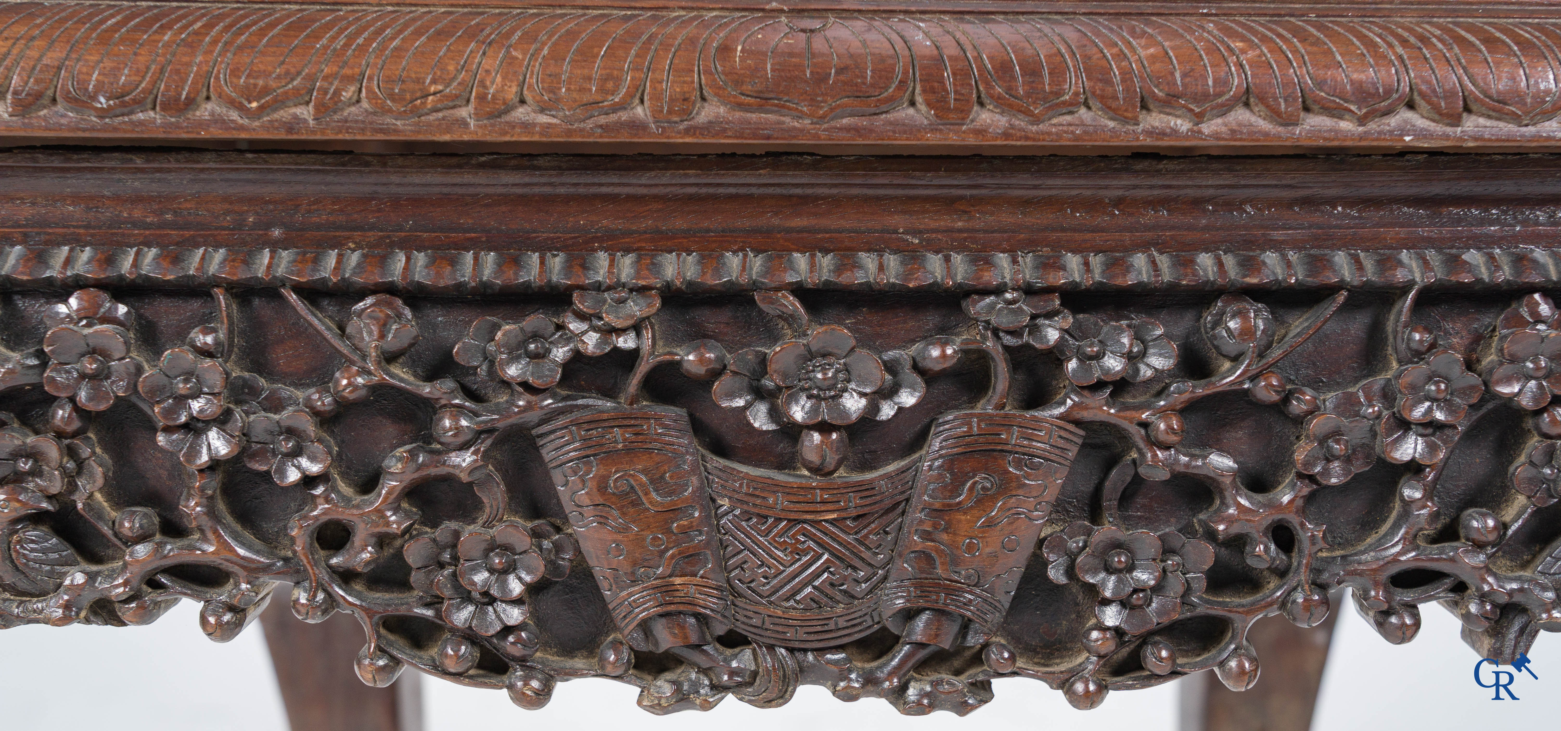 Asian Art, A pair of richly carved chairs with bats, dragons and flowers in Chinese hardwood. 19th century.