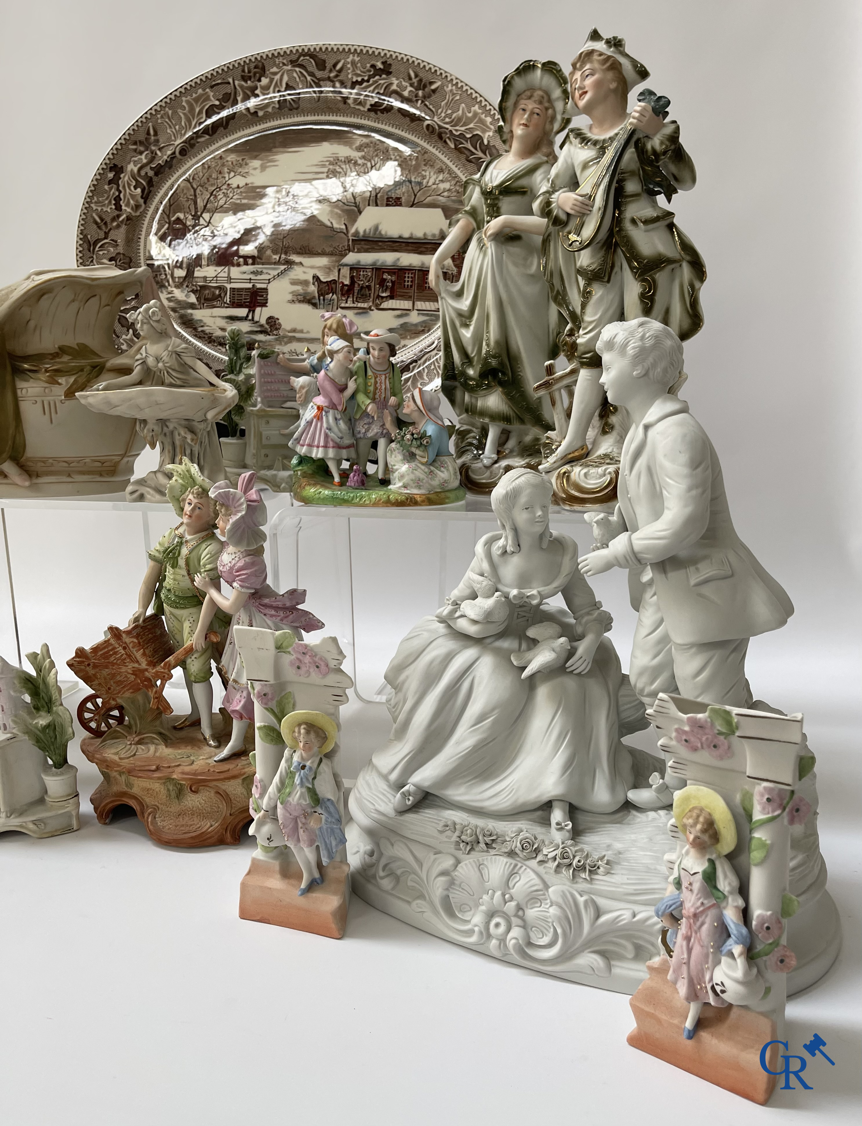 A large lot of brocante including Royal Dux, Biscuit statues, porcelain, globes, spelter statues, table lamp, chandelier etc.