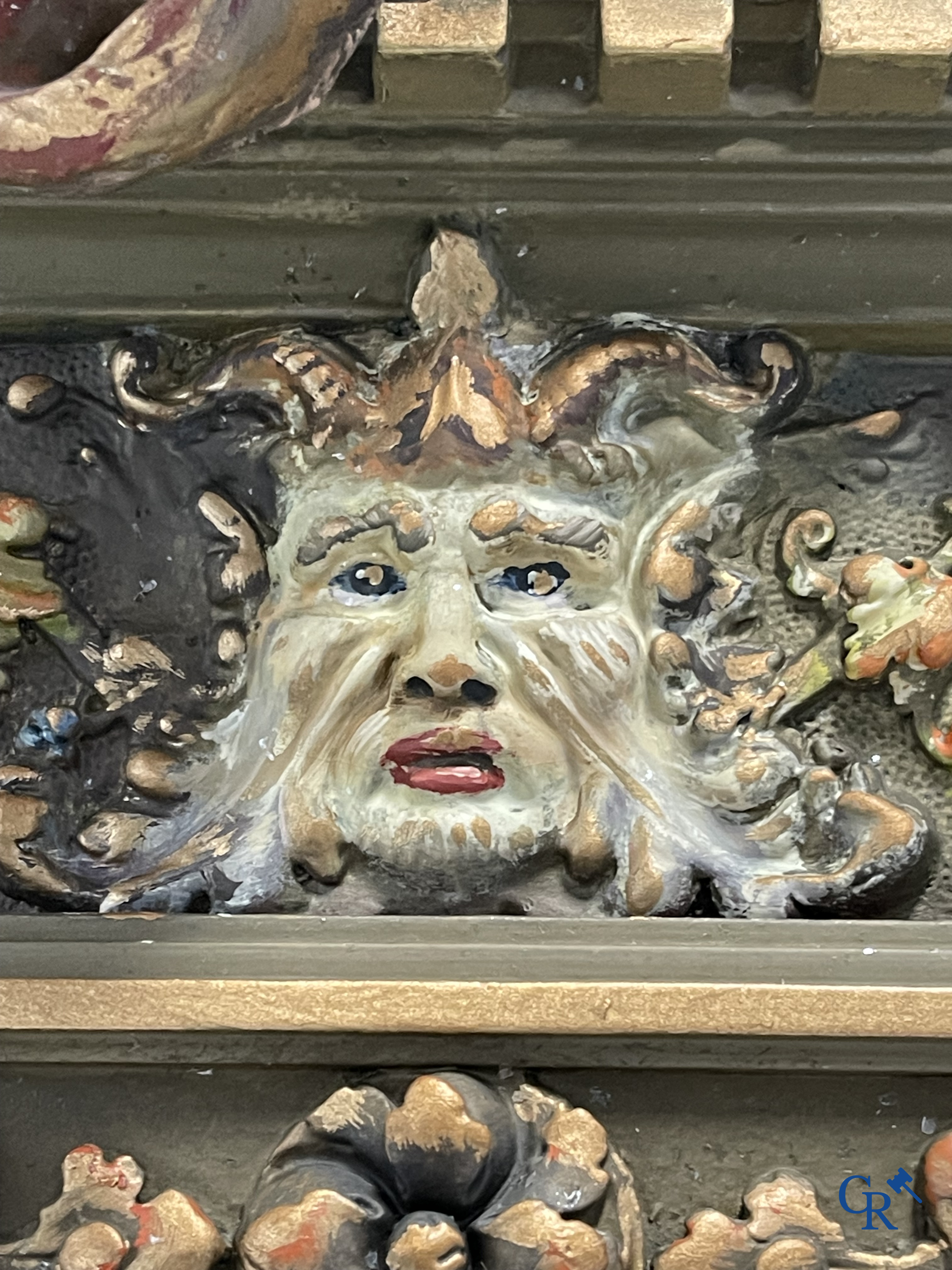 A large patinated fireplace mirror with a dragon. Around 1900.