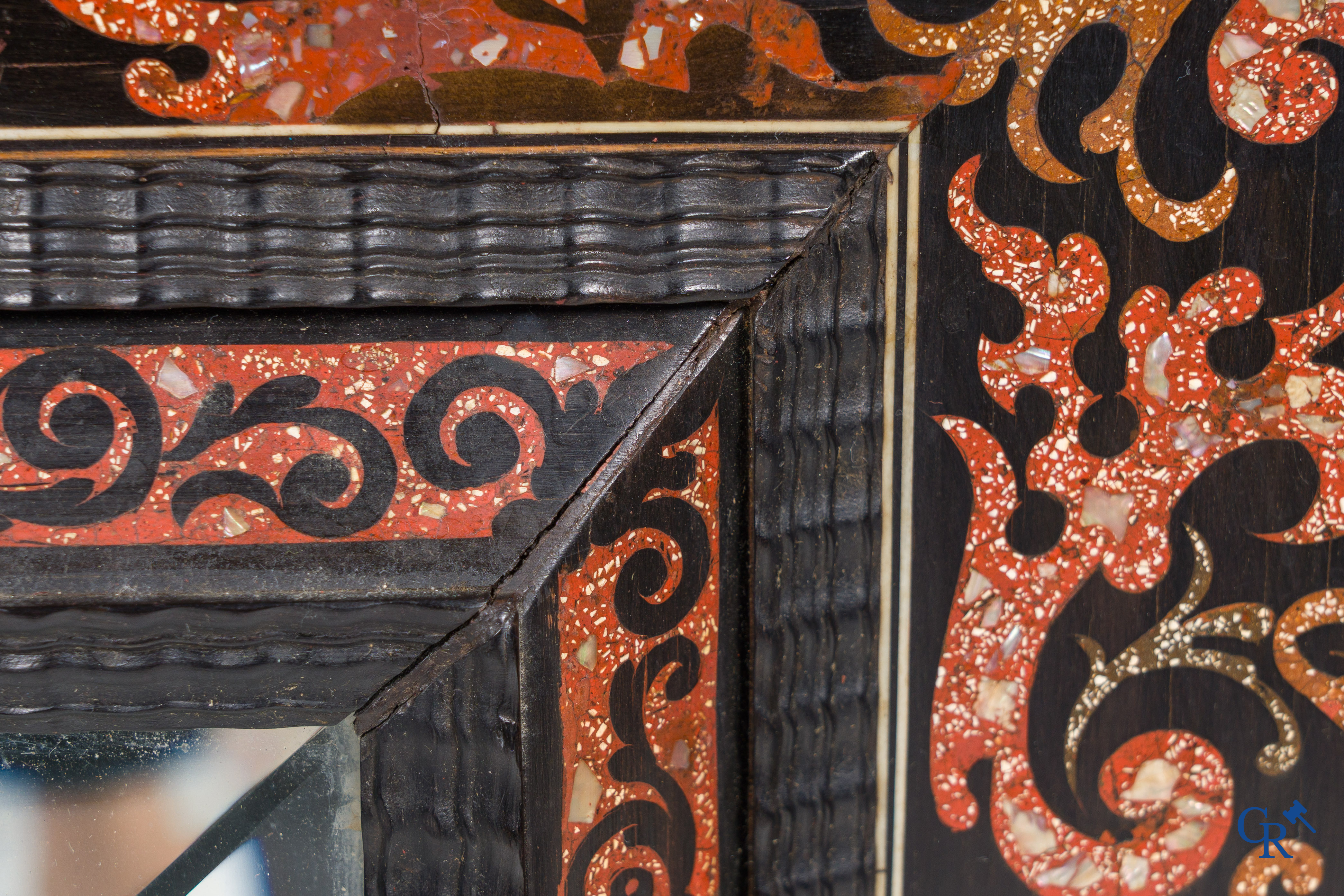 A mirror in ebony and inlay. 18th- 19th century.