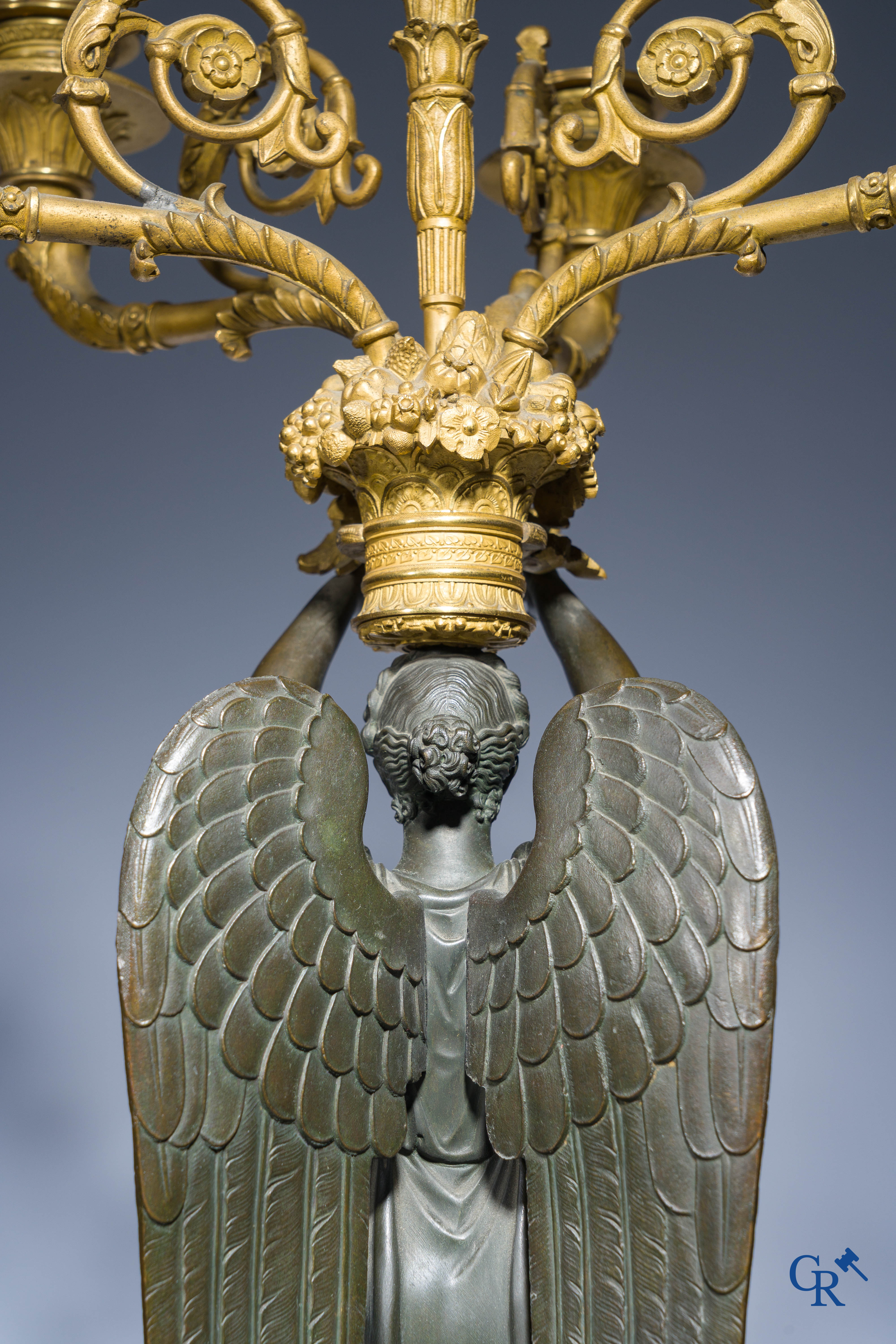 Empire, A pair of large gilded and patinated bronze candlesticks with winged women, circa 1810.