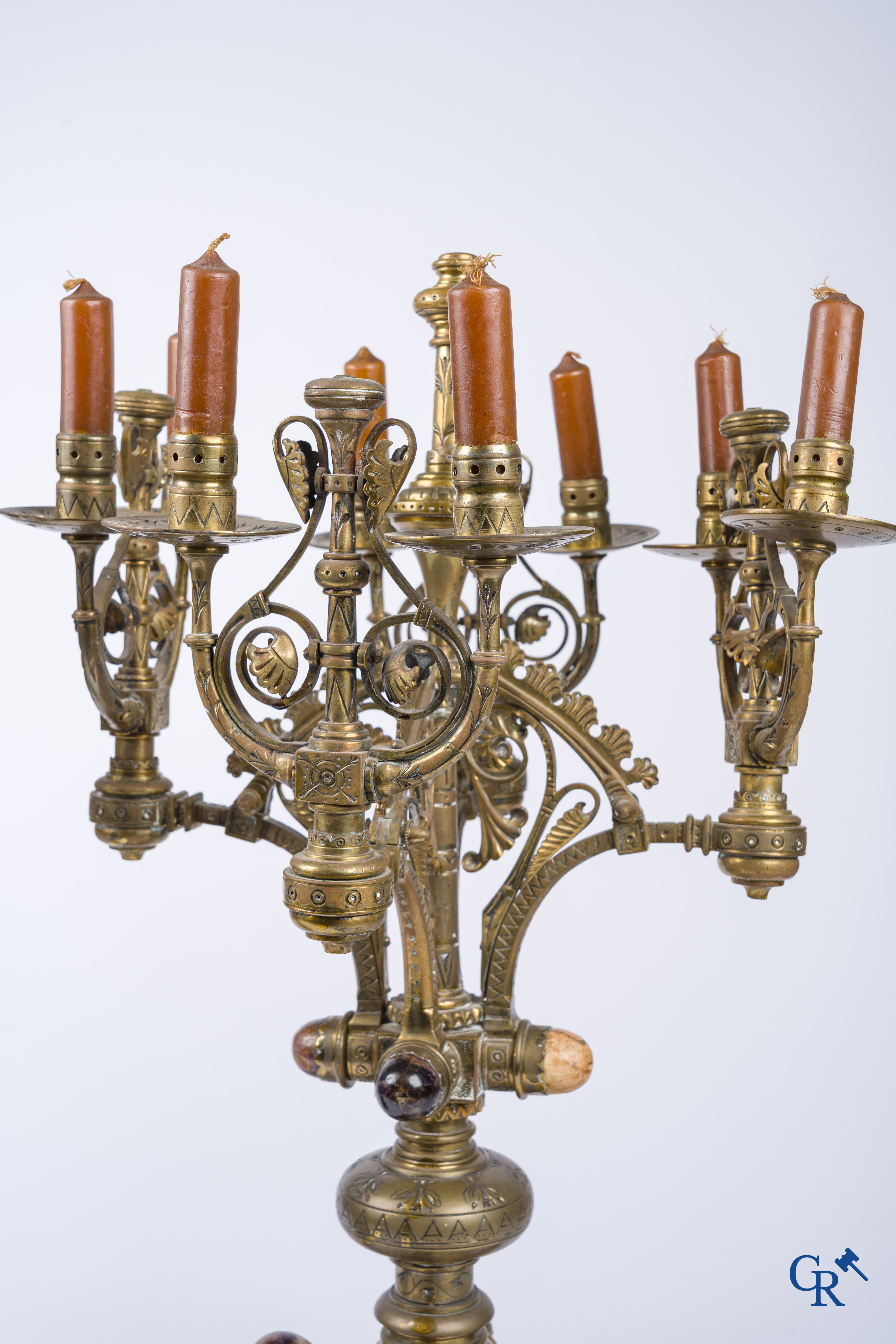 A pair of important bronze candlesticks decorated with various types of rock including amethyst. 19th century.