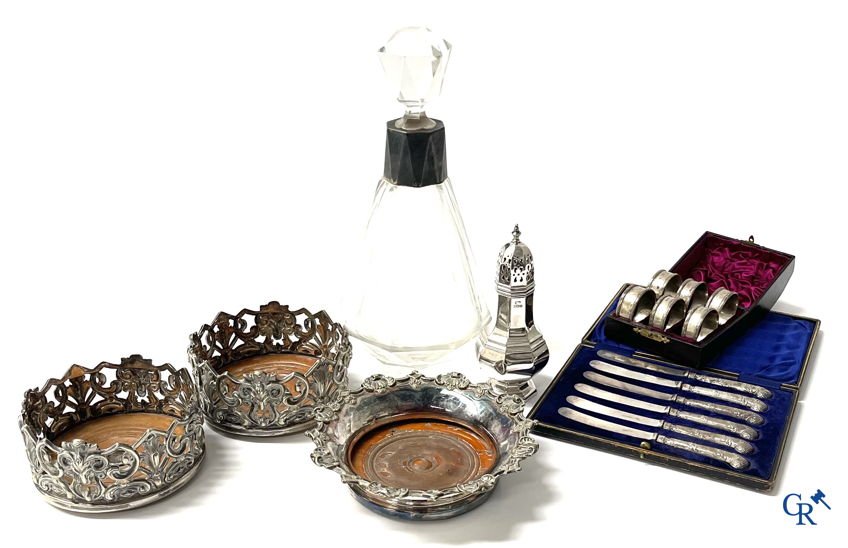 A set of 10 silver-plated metal table bells, a carafe with silver frame, silver napkin rings, a sprinkler bus, etc.