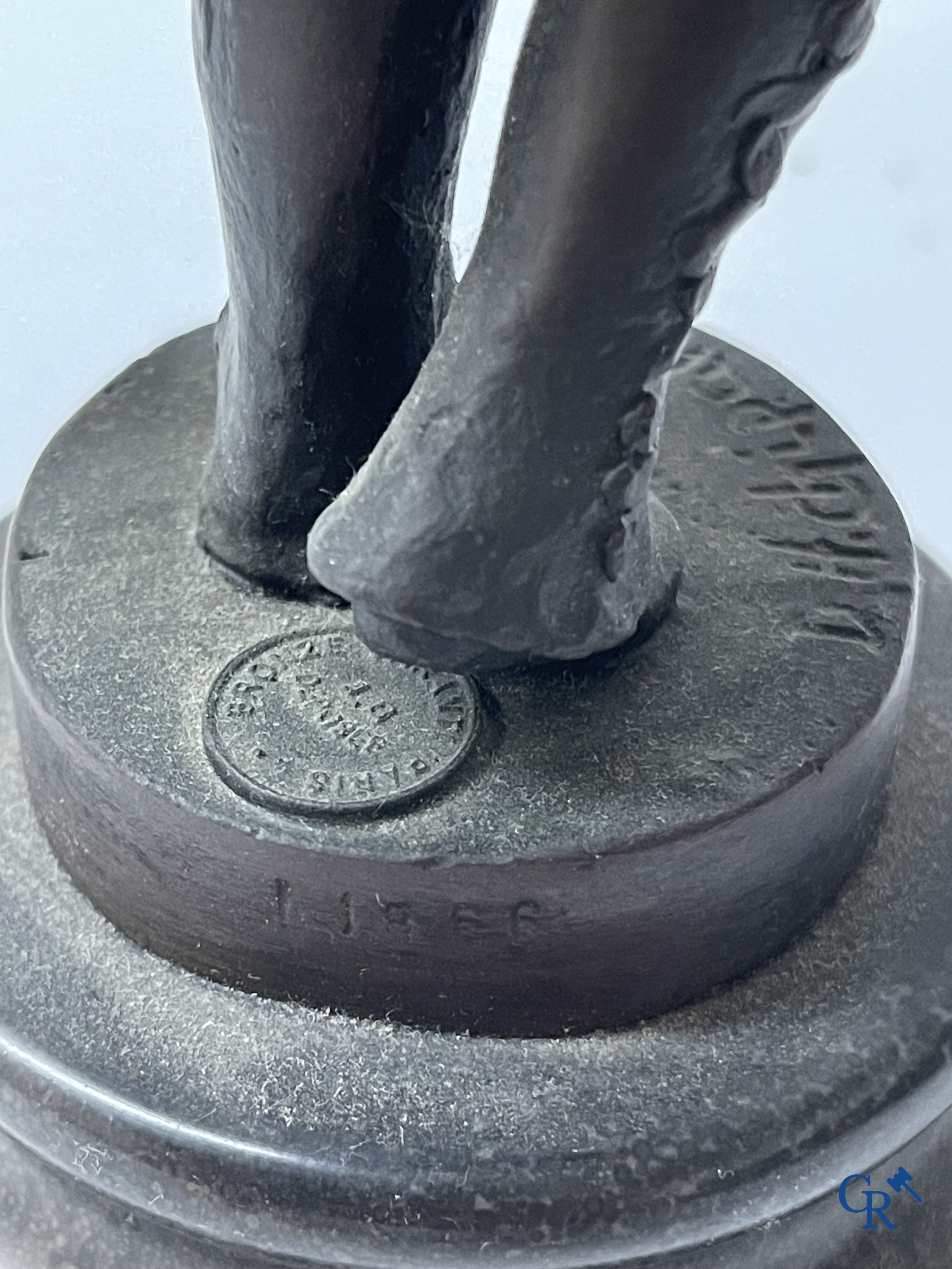 A bronze group after Raoul Larche with 5 children and a basket and 2 bronze statuettes after Chiparus. Posthumous 20th century.