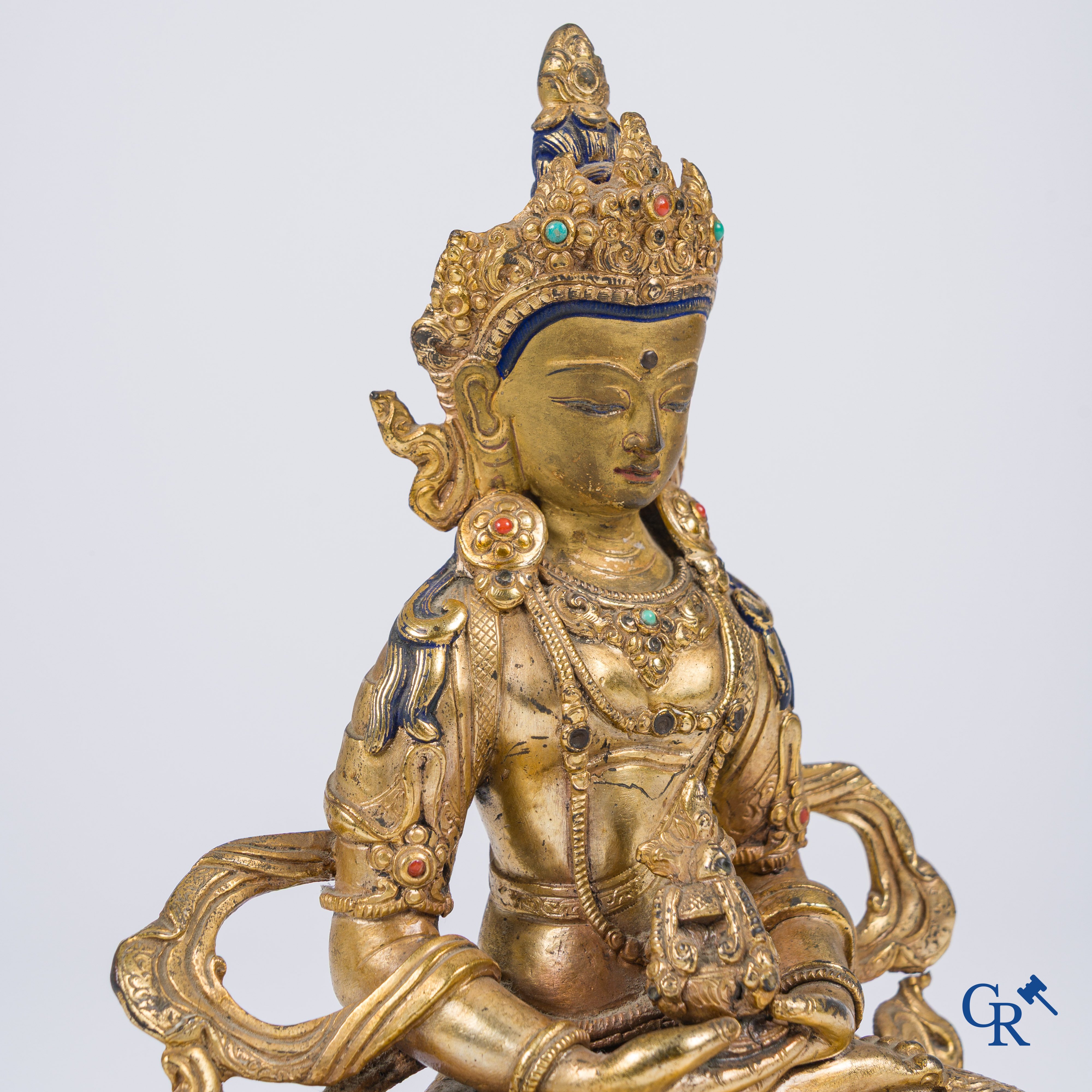 Asian Art, Tibet, a Chinese gilded Buddha Amitayus. Bronze with turquoise and coral inlay.