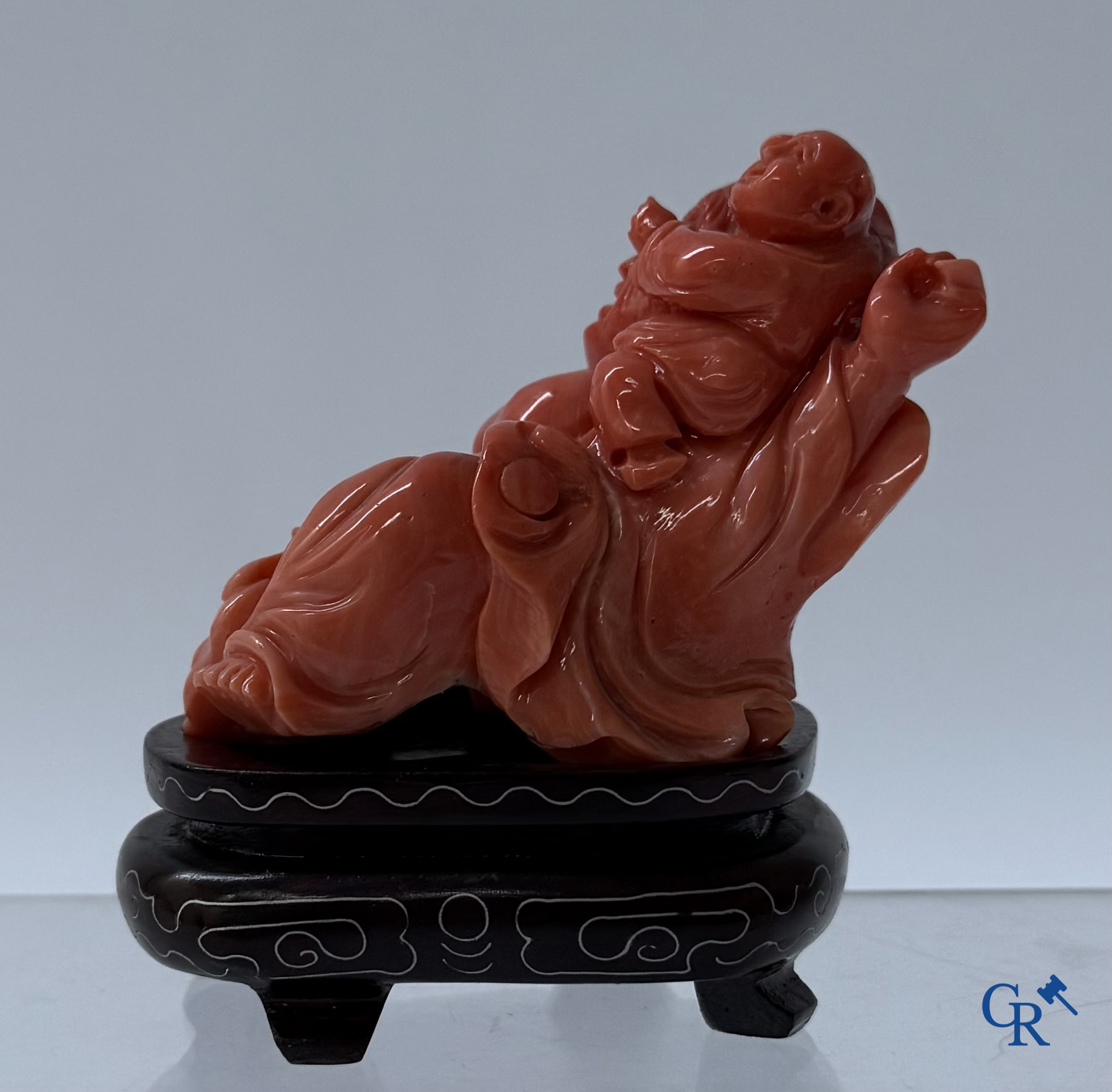 Asian Art, a Chinese carved red coral Buddha figure with child.