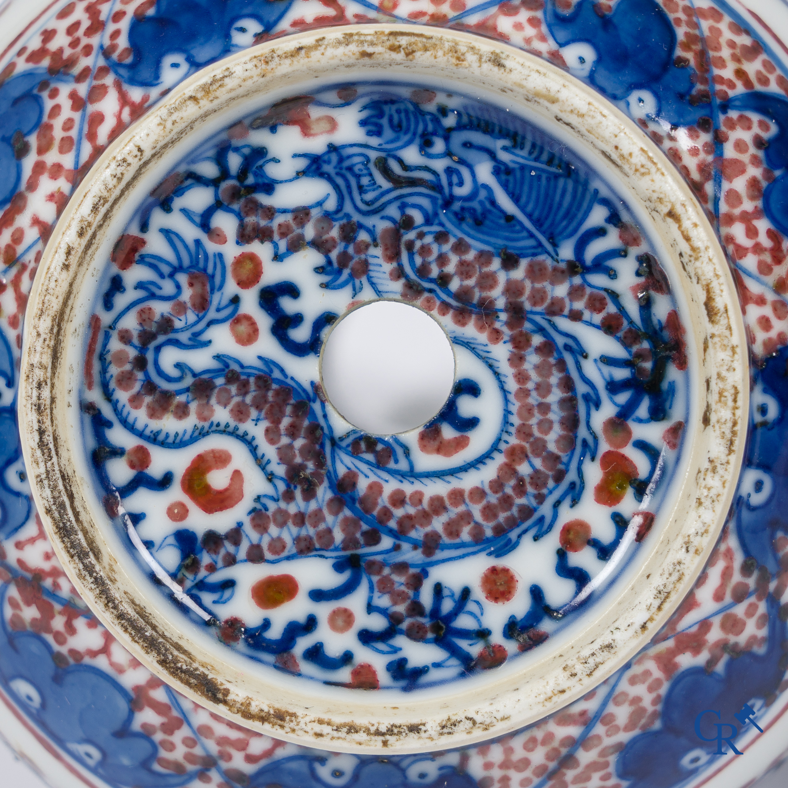 Asian Art, Chinese porcelain. A pair of blue-white and iron-red decorated vases with bats and a dragon bottom mark.