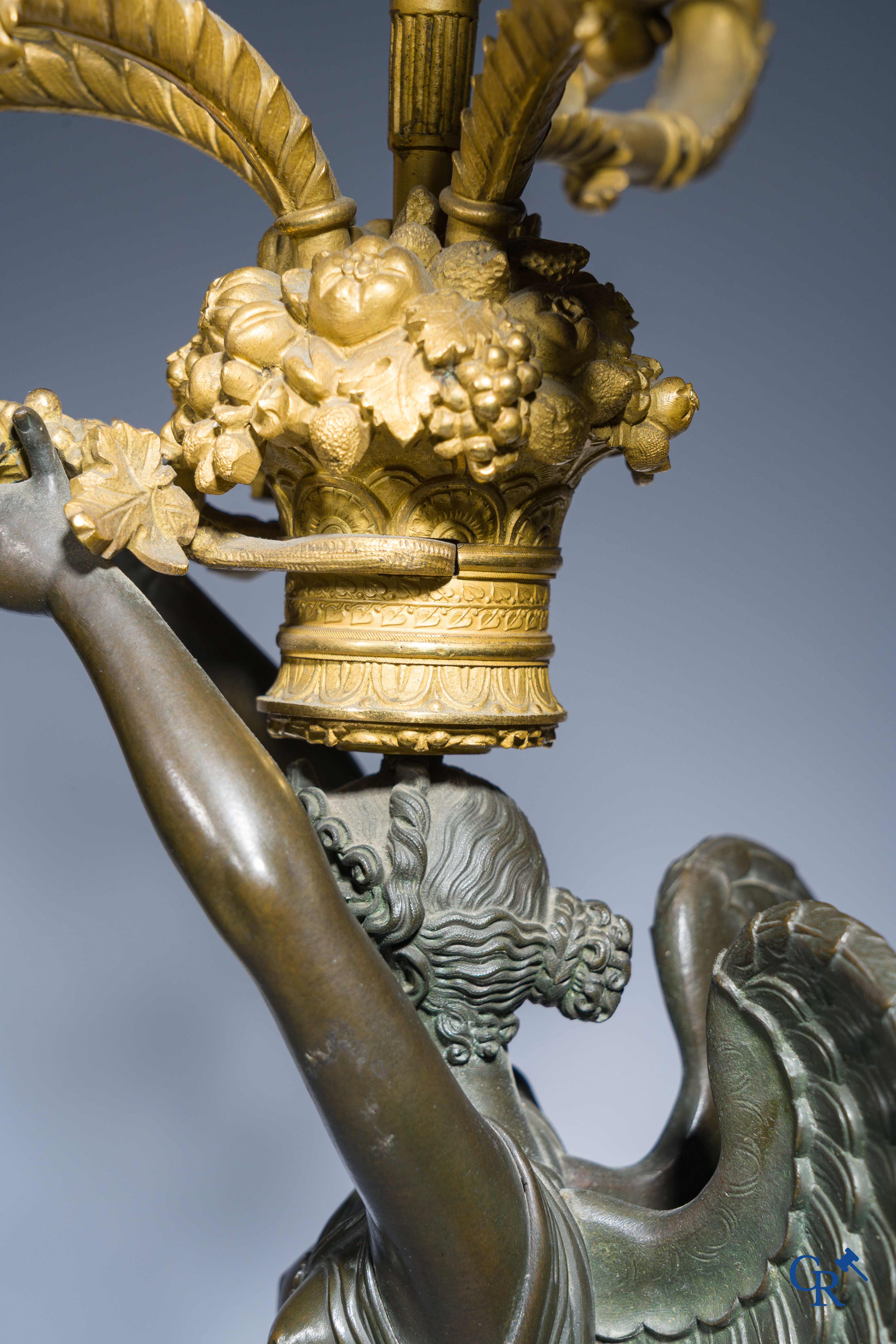 Empire, A pair of large gilded and patinated bronze candlesticks with winged women, circa 1810.