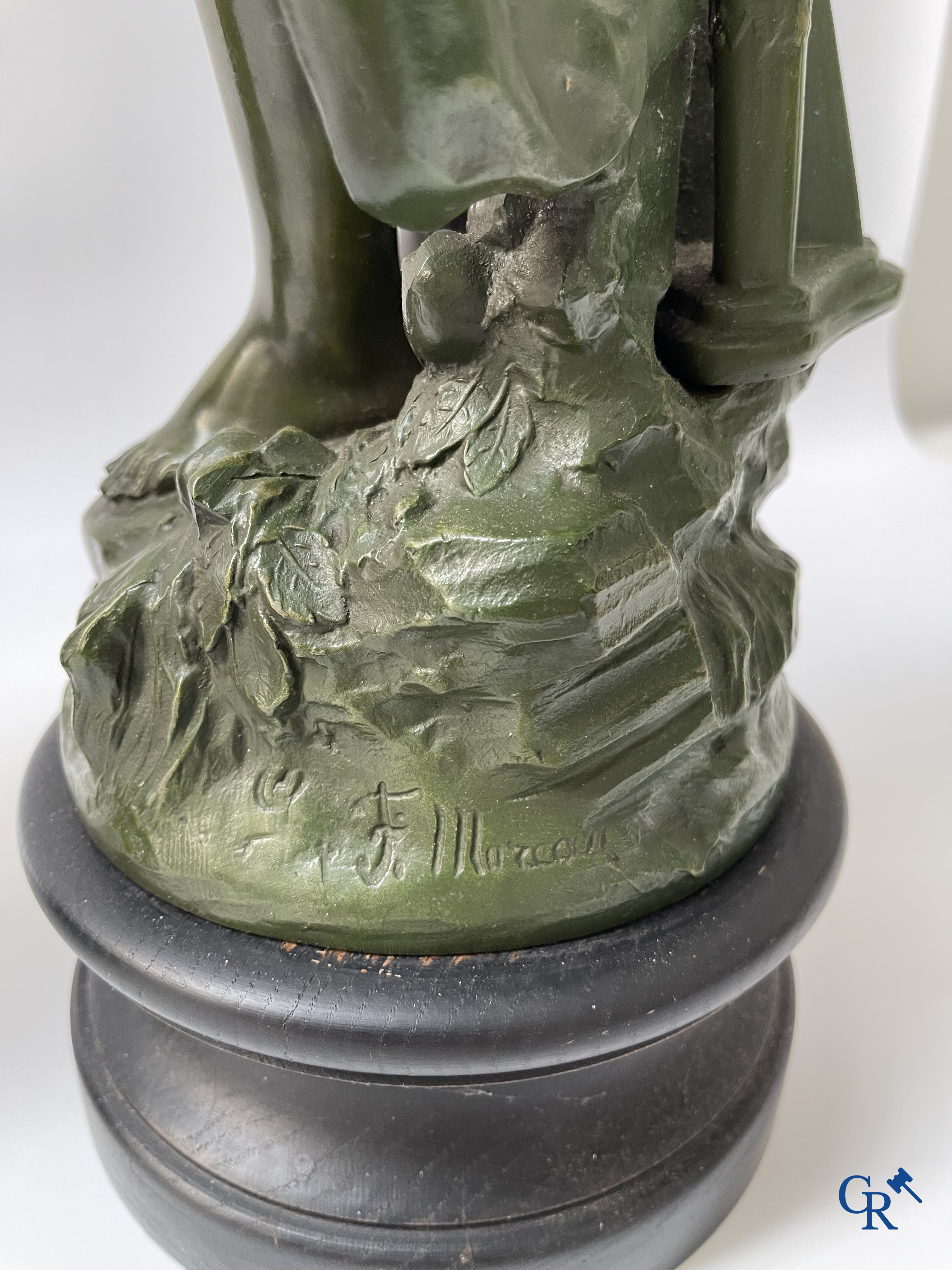 Louis & François Moreau, A large pair of statues in green patinated spelter on a wooden base. Signed L&F Moreau.