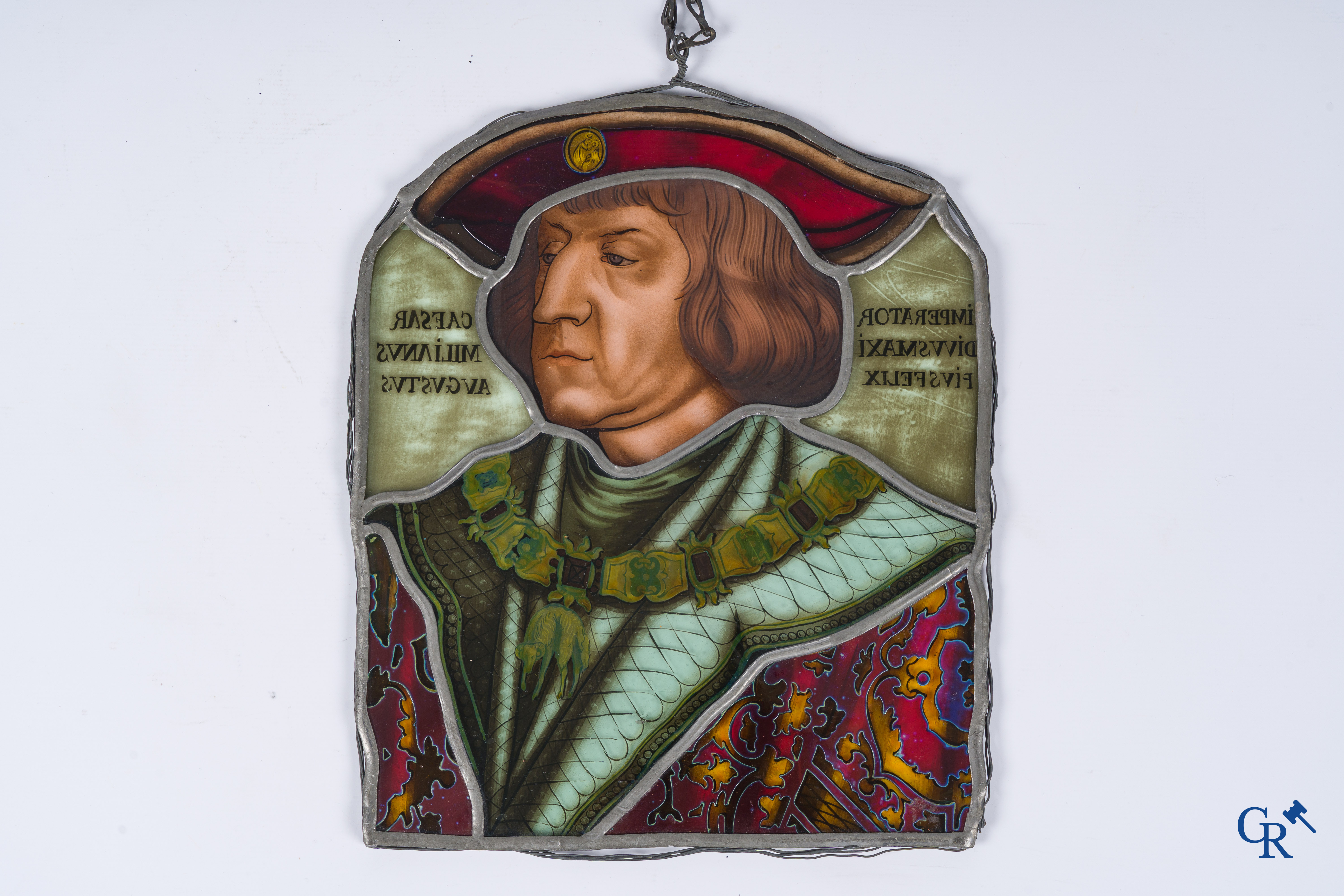 A fragment of an antique stained glass with the portrait of Maximilian I of Austria.