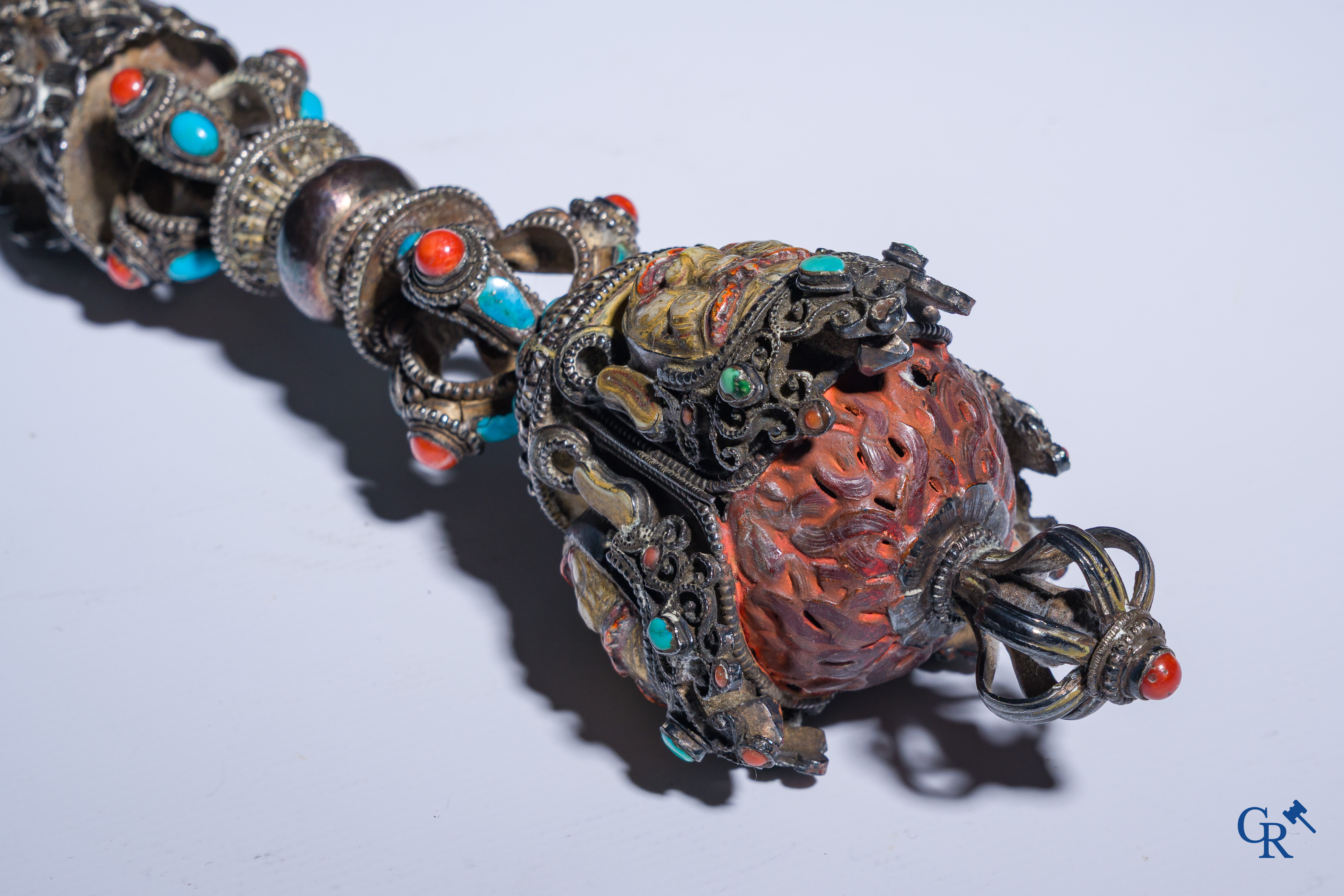 Asian Art, Phurba. Tibetan ritual dagger in silver, inlaid with turquoise and red coral.