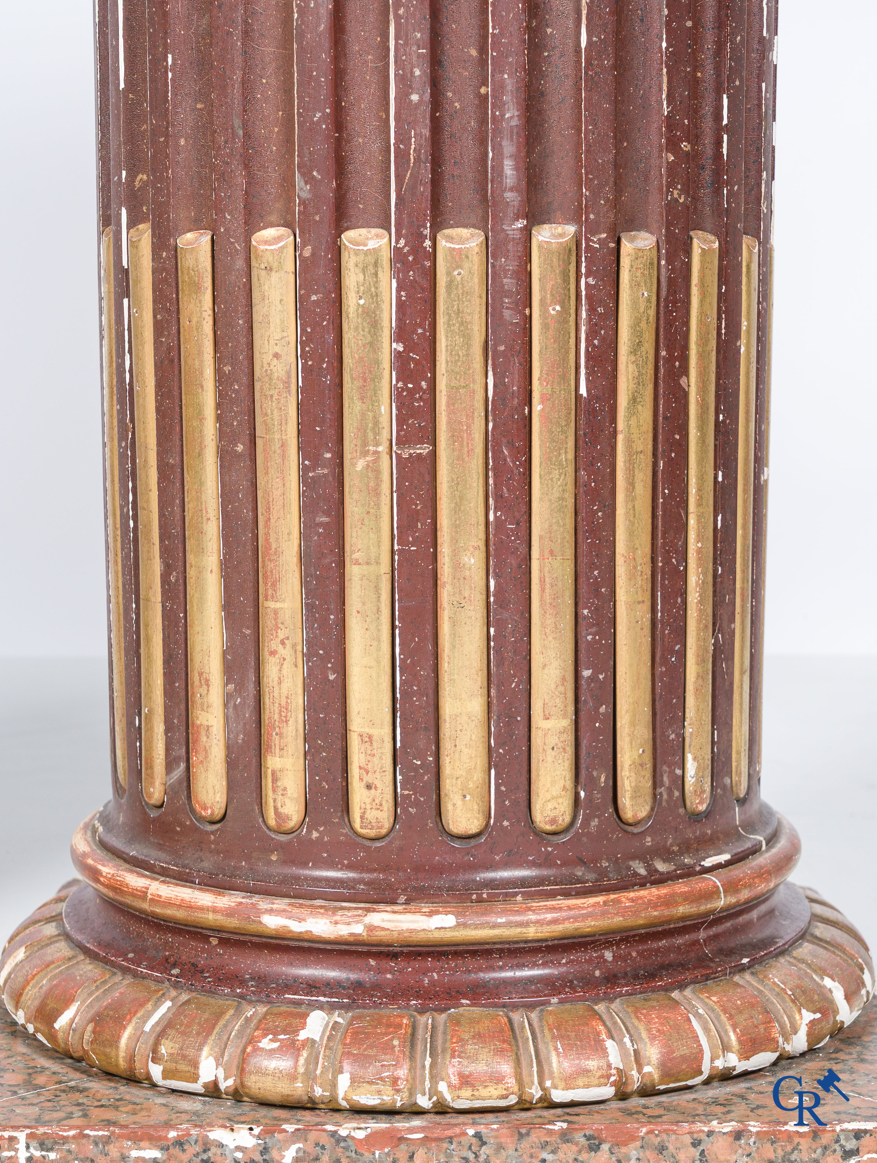 A pair of fluted, patinated and gilded wood sculpted columns. 19th century.