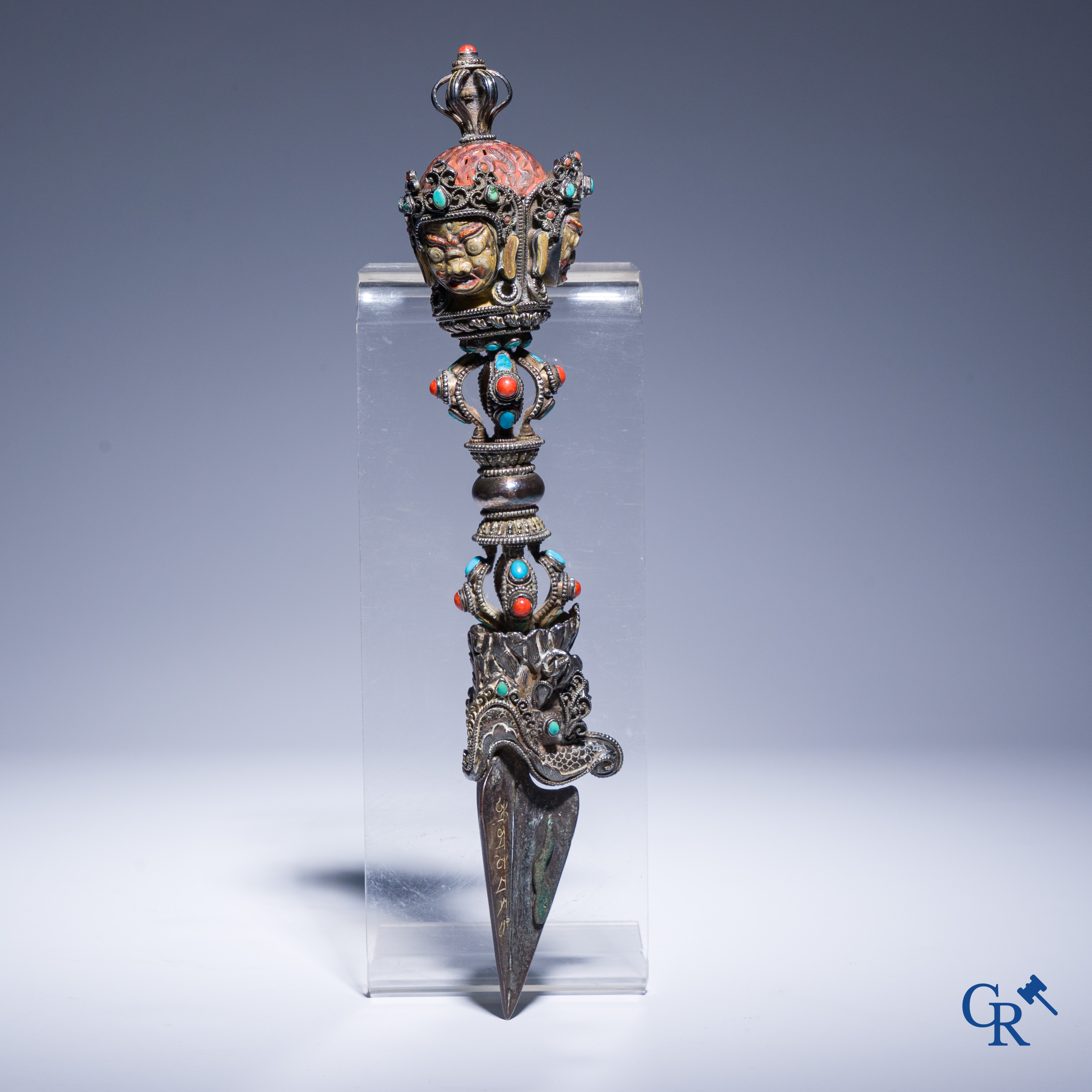 Asian Art, Phurba. Tibetan ritual dagger in silver, inlaid with turquoise and red coral.