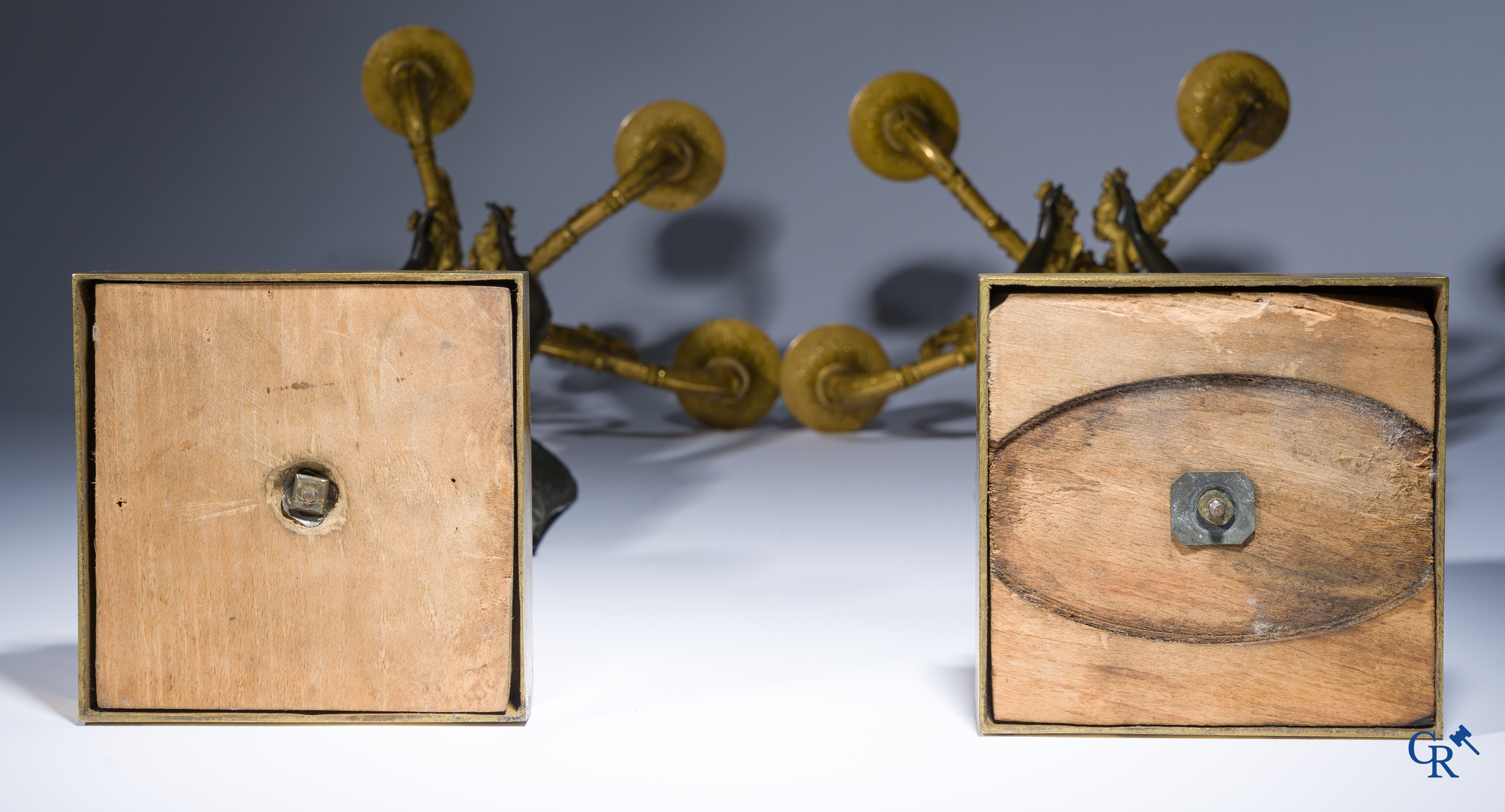 Empire, A pair of large gilded and patinated bronze candlesticks with winged women, circa 1810.