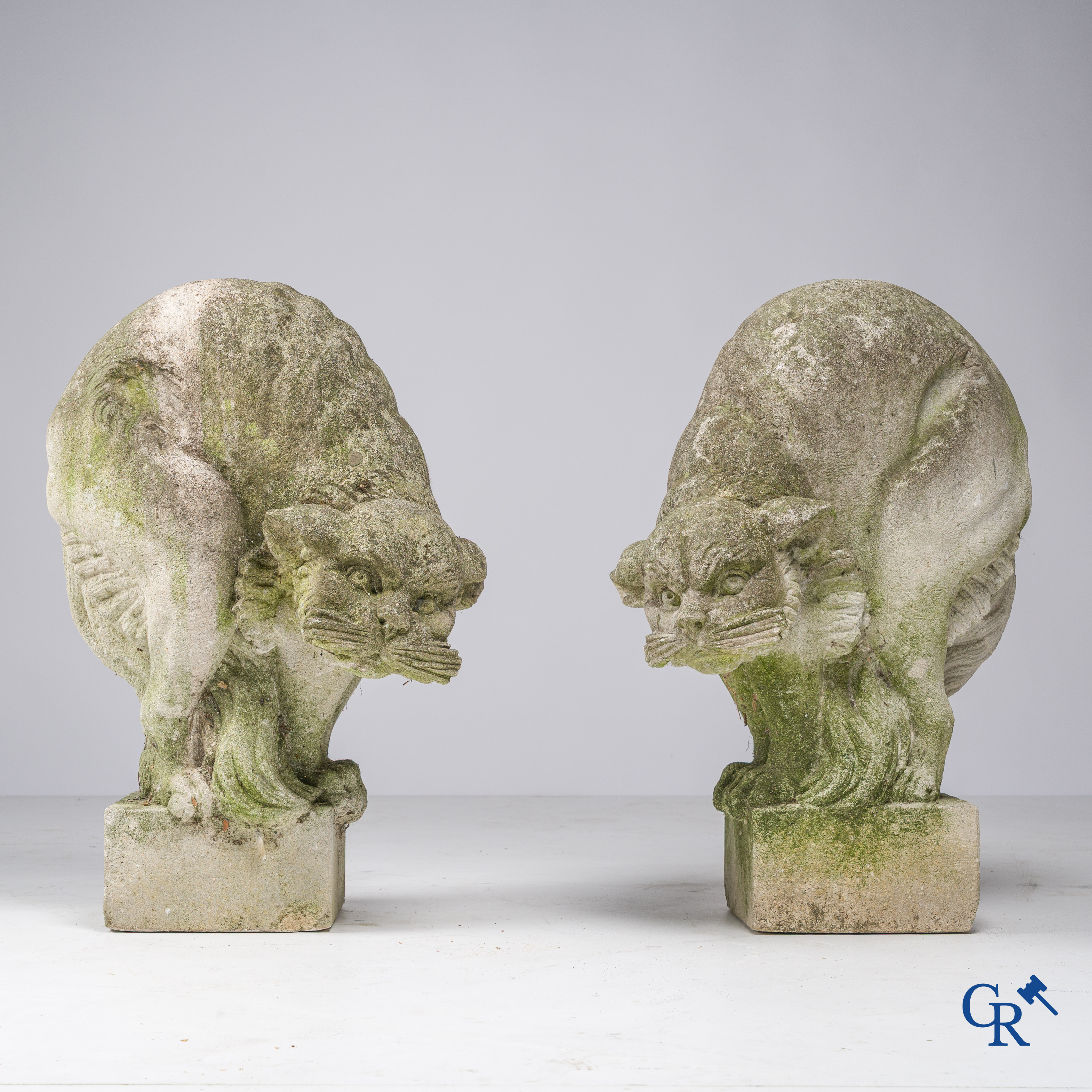Exceptionally pair of large ornaments depicting cats in hand-sculpted limestone. Circa 1900.