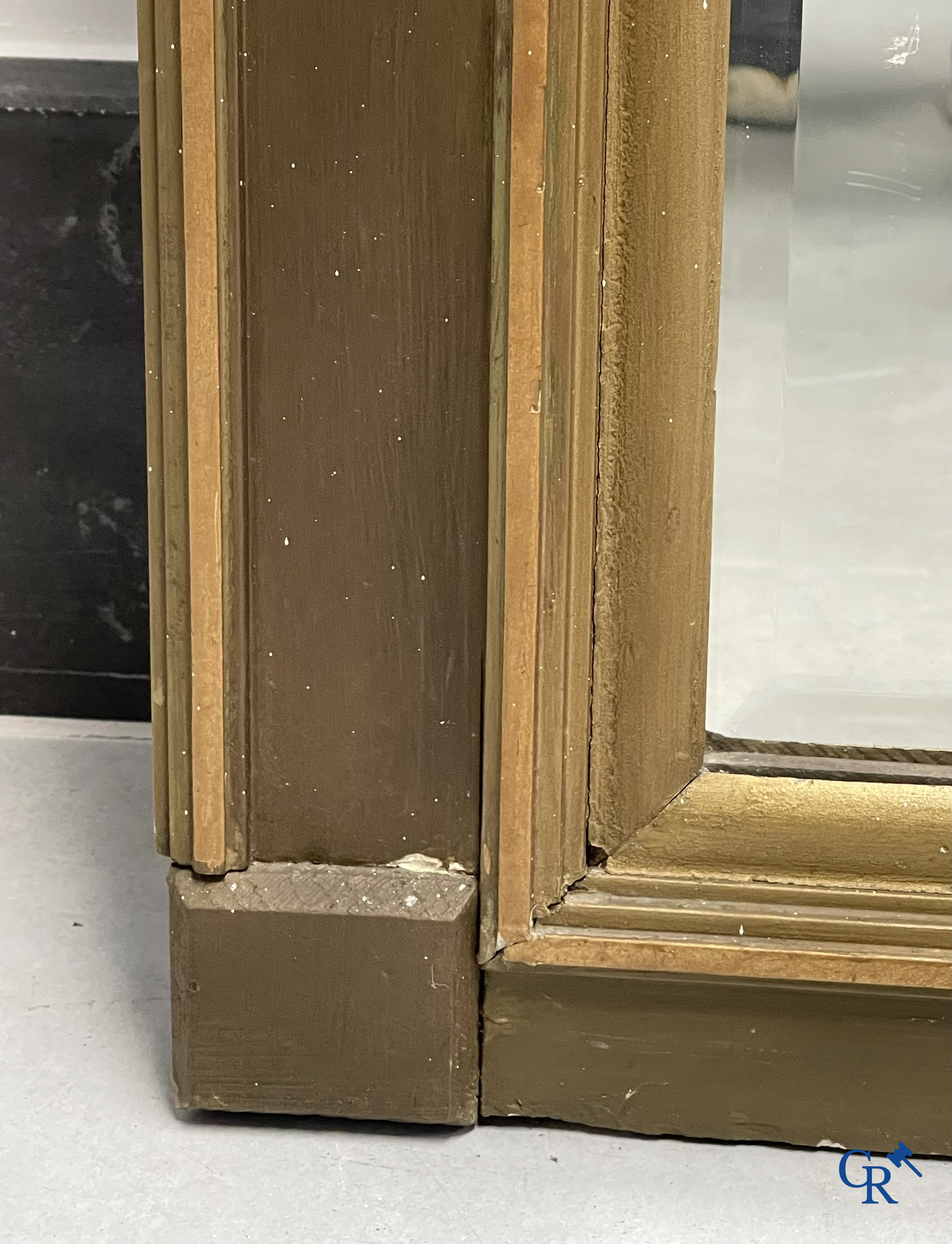 A large patinated fireplace mirror with a dragon. Around 1900.