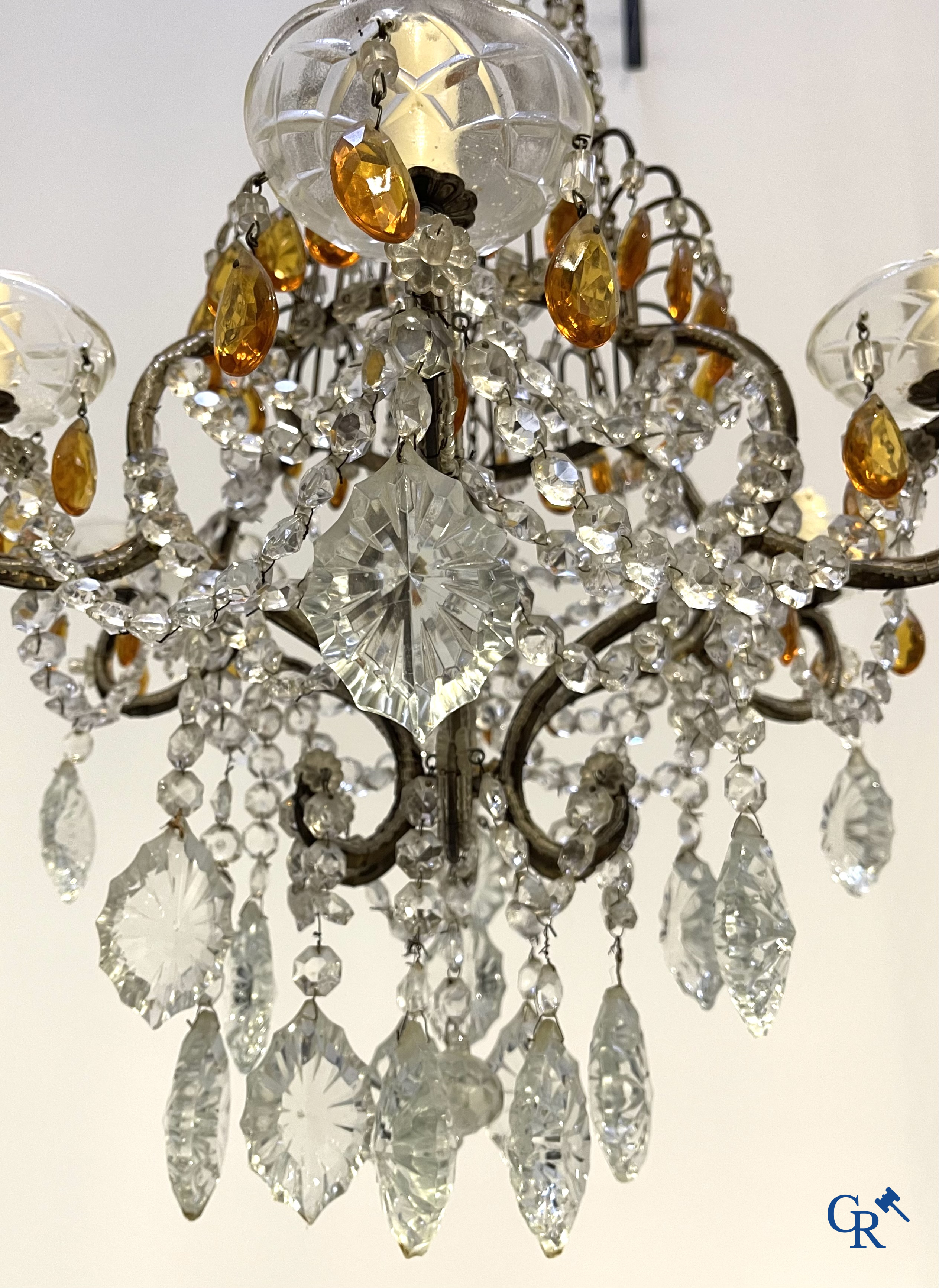 A large chandelier in crystal with double pearls on the frame.