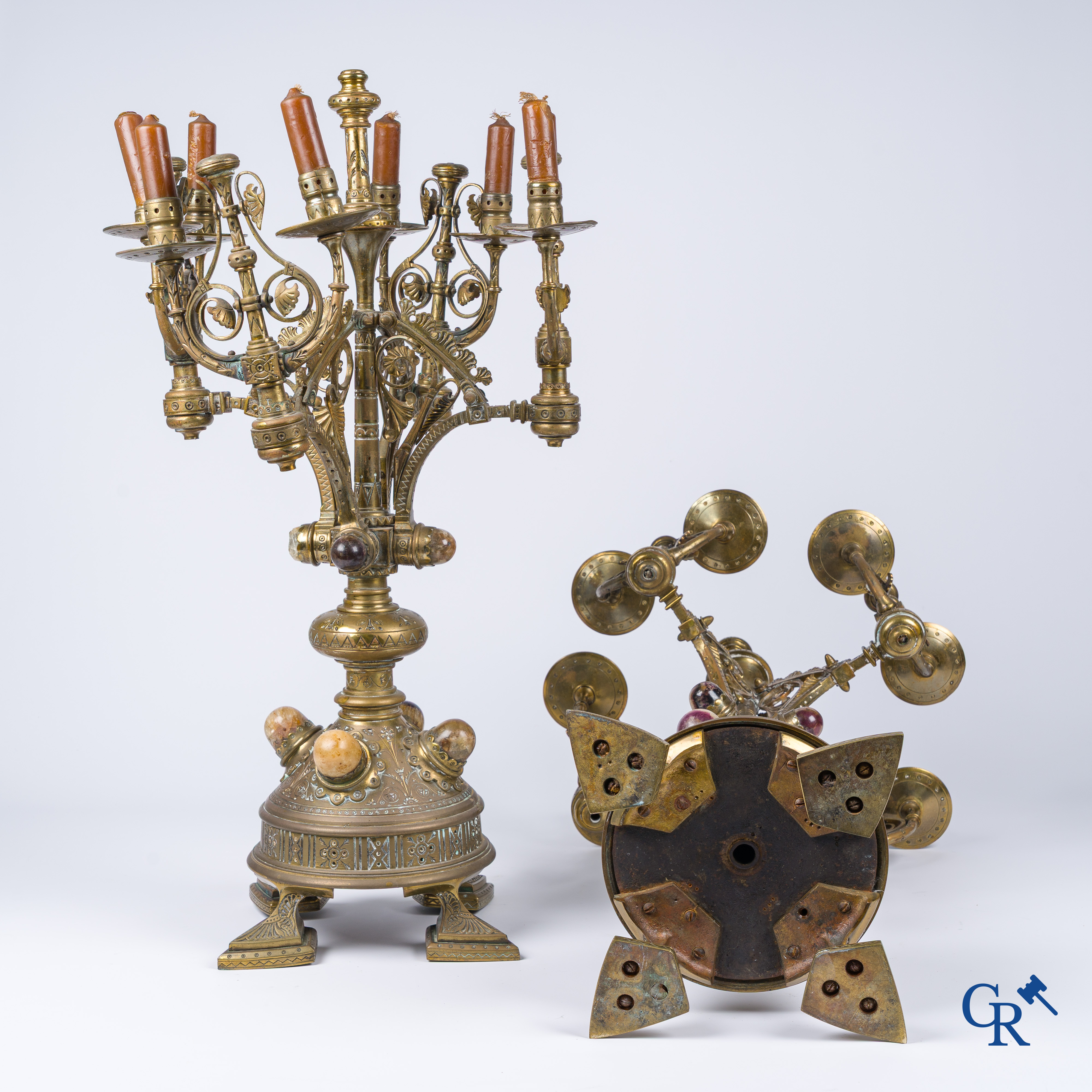 A pair of important bronze candlesticks decorated with various types of rock including amethyst. 19th century.